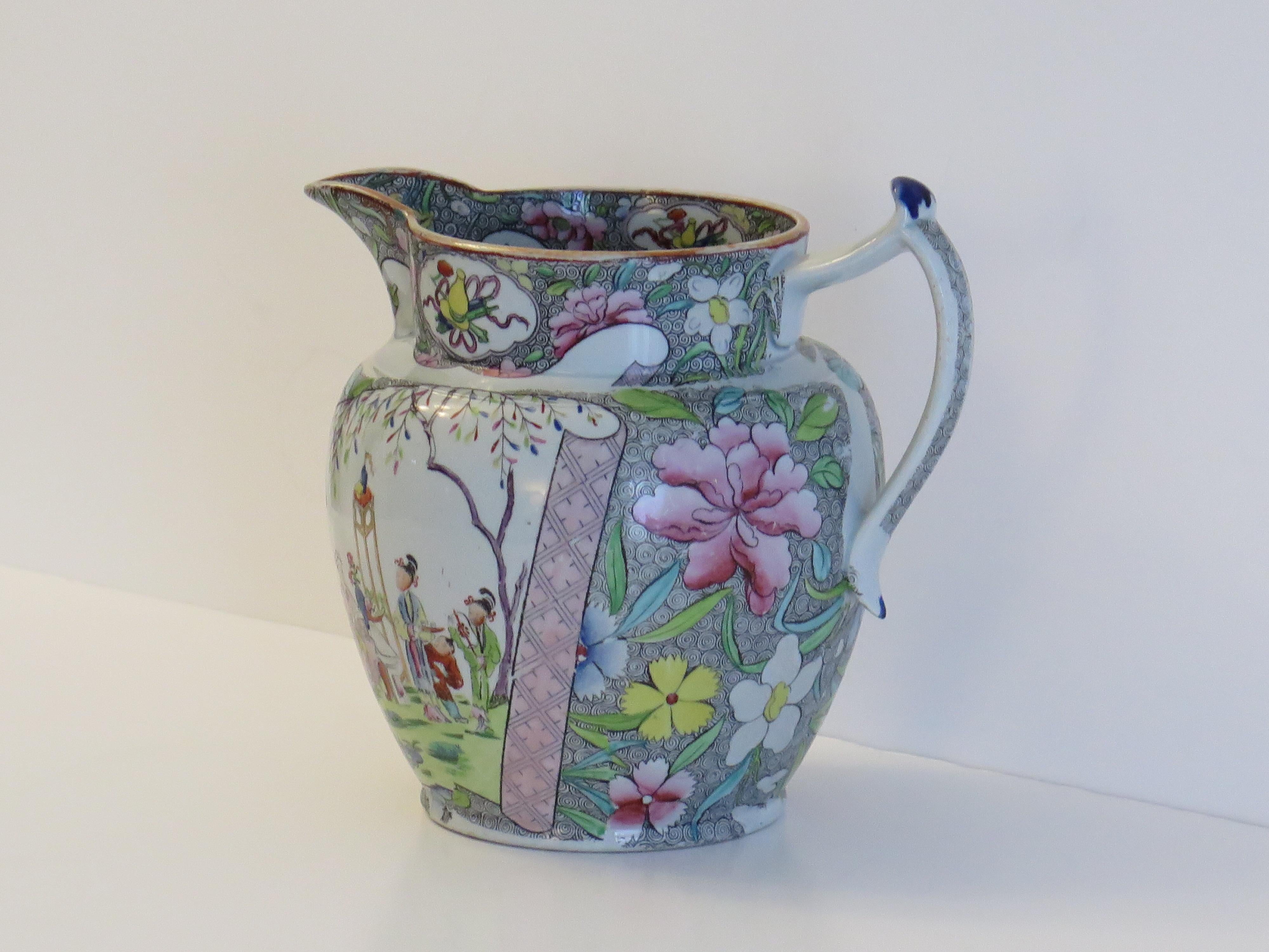 This is an Ironstone pottery, large Jug or Pitcher made by the Mason's factory at Lane Delph, Staffordshire, England and is decorated in the Chinese Scroll Pattern, fully stamped and dating to the earliest period of Mason's Ironstone production,