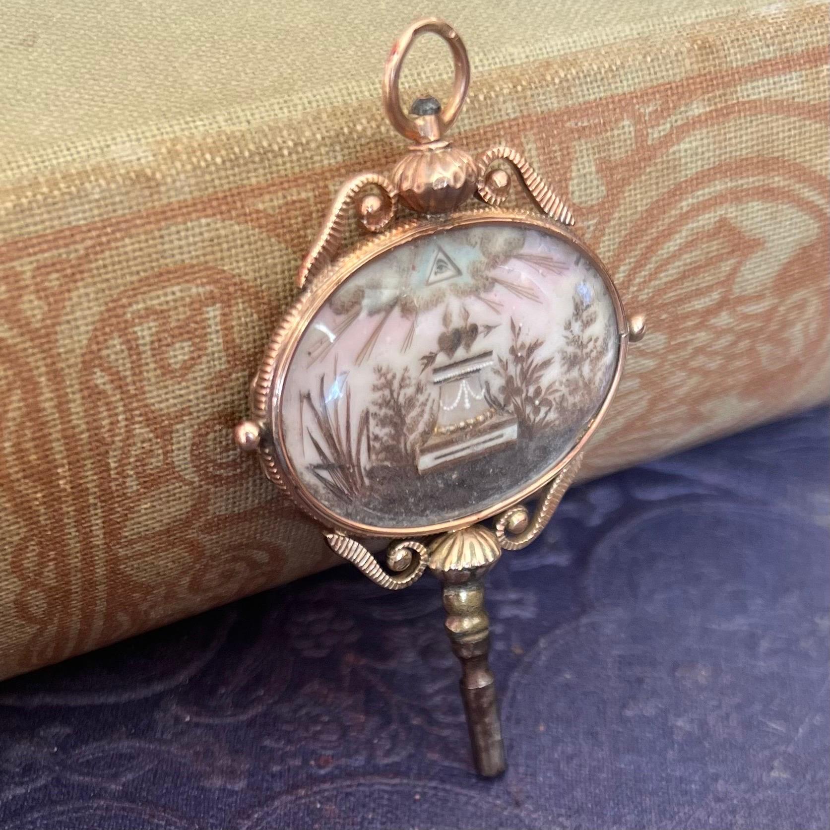 An exceptional antique Georgian pocket watch key, made of pink gold. The pink gold key is decorated and surrounded by detailed hollow curled figures on its border which features delicate decorative engravings on both sides. For the presentation