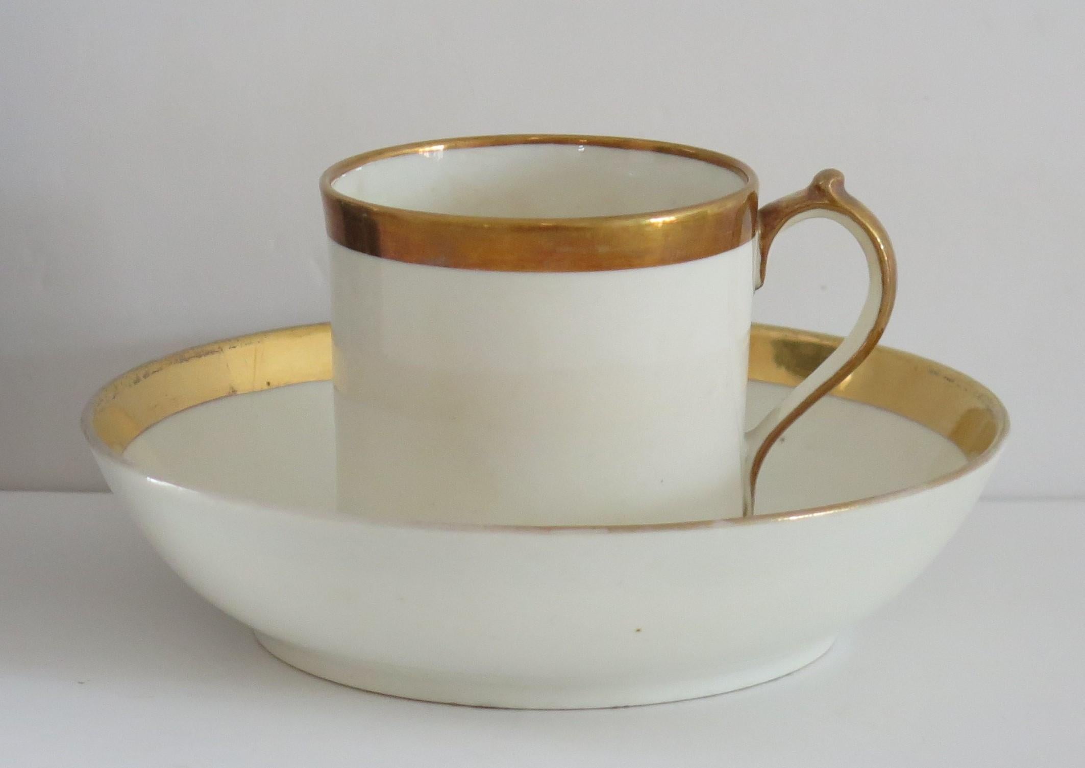 This is a fine porcelain coffee can & saucer duo made by Miles Mason, of Lane Delph, Stoke on Trent, England, circa 1805. It has a plain loop handle with the characteristic upper spur which is a known Miles Mason handle shape.

Miles Mason was the