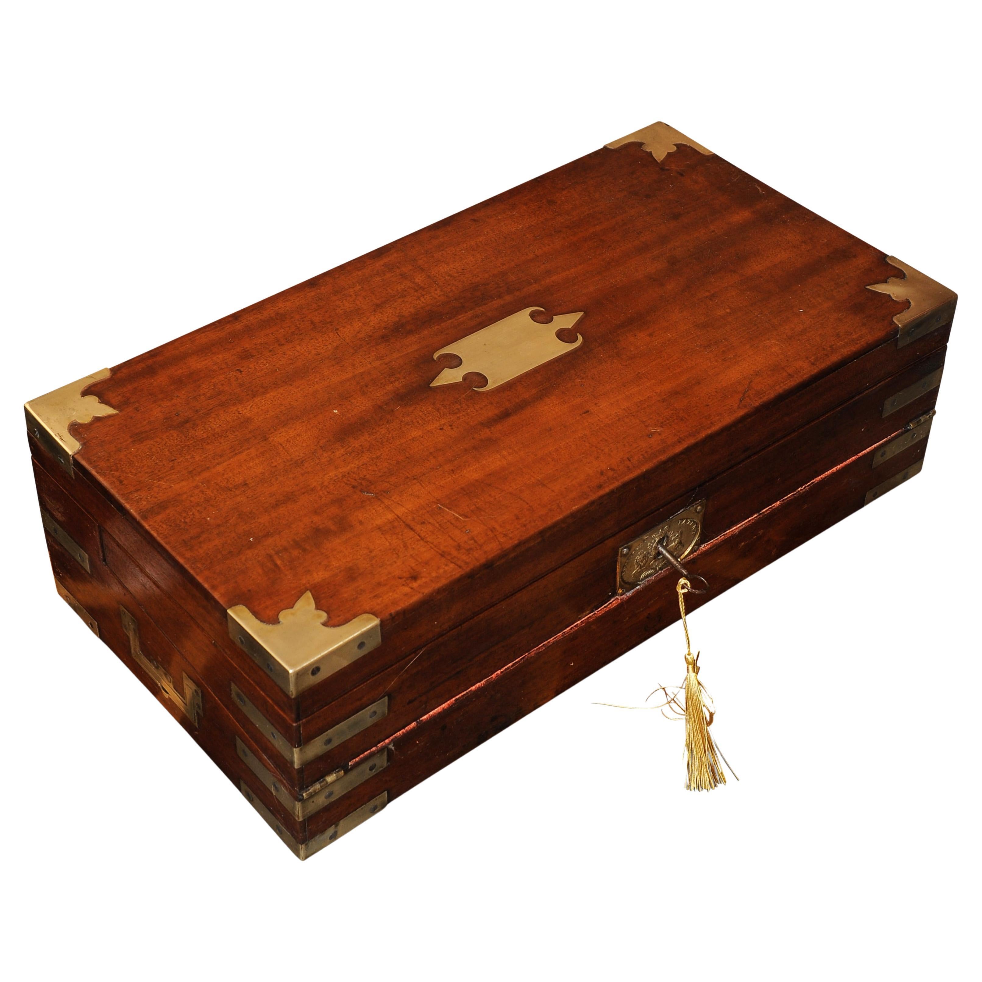 A stunning georgian military campaign rosewood & brass bound hand crafted writing slope.
With Red Tooled Leather Interior, Befit with the original glass inkwells.
Made by Esteemed Maker with Royal Warrant 