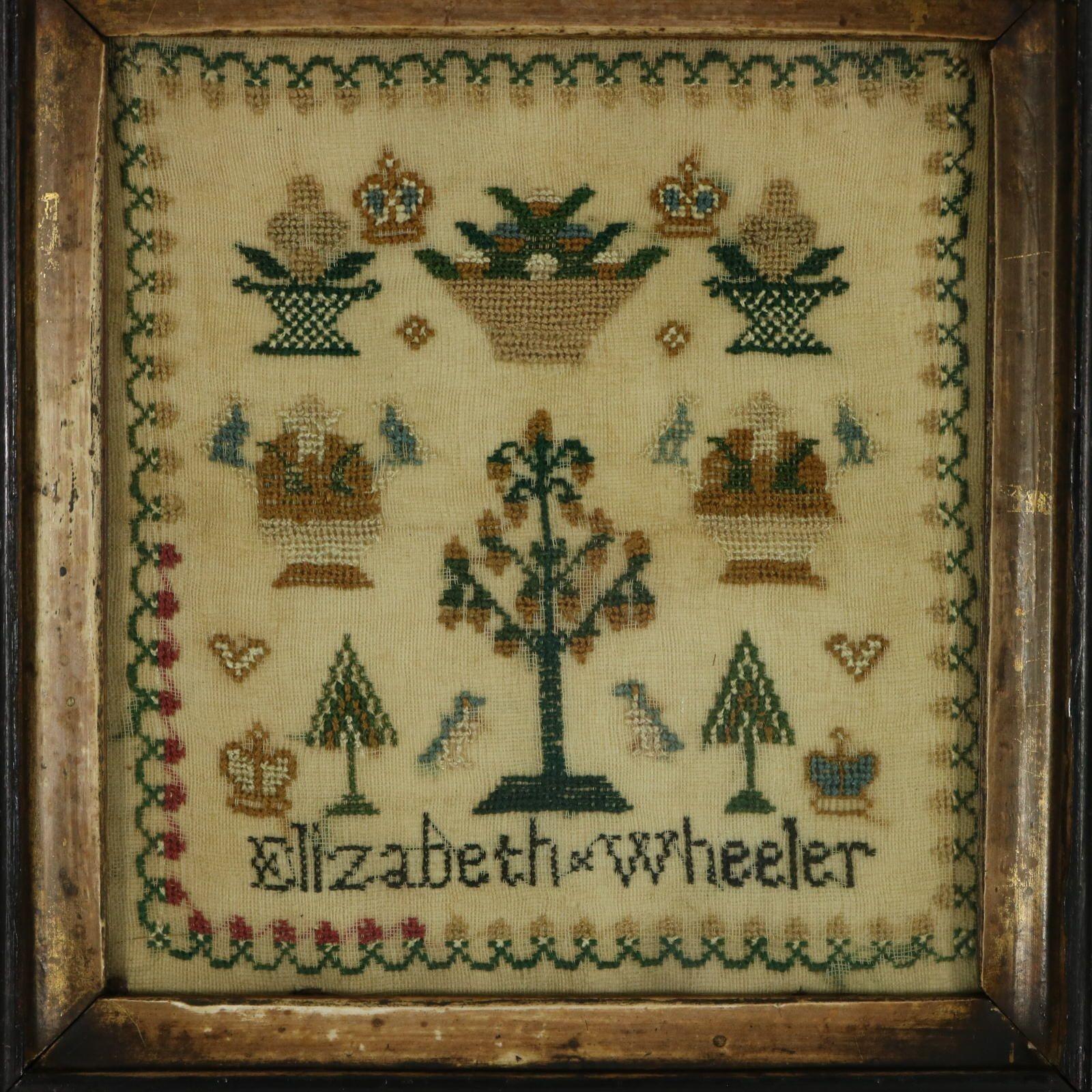 Georgian Miniature Sampler, by Elizabeth Wheeler. The sampler is worked in silk threads on a linen ground, in cross stitch. Meandering strawberry border. Colours green, light brown, silver, red and blue. Signed 'Elizabeth Wheeler'. A wonderful set