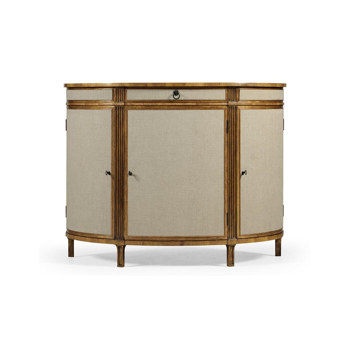 Georgian Modern Demi Lune Cabinet – a sophisticated fusion of classic and contemporary design. Expertly crafted, this cabinet boasts a solid case with Kravet linen fabric cabinet doors and understated hardware. The grey fruitwood top, which sits