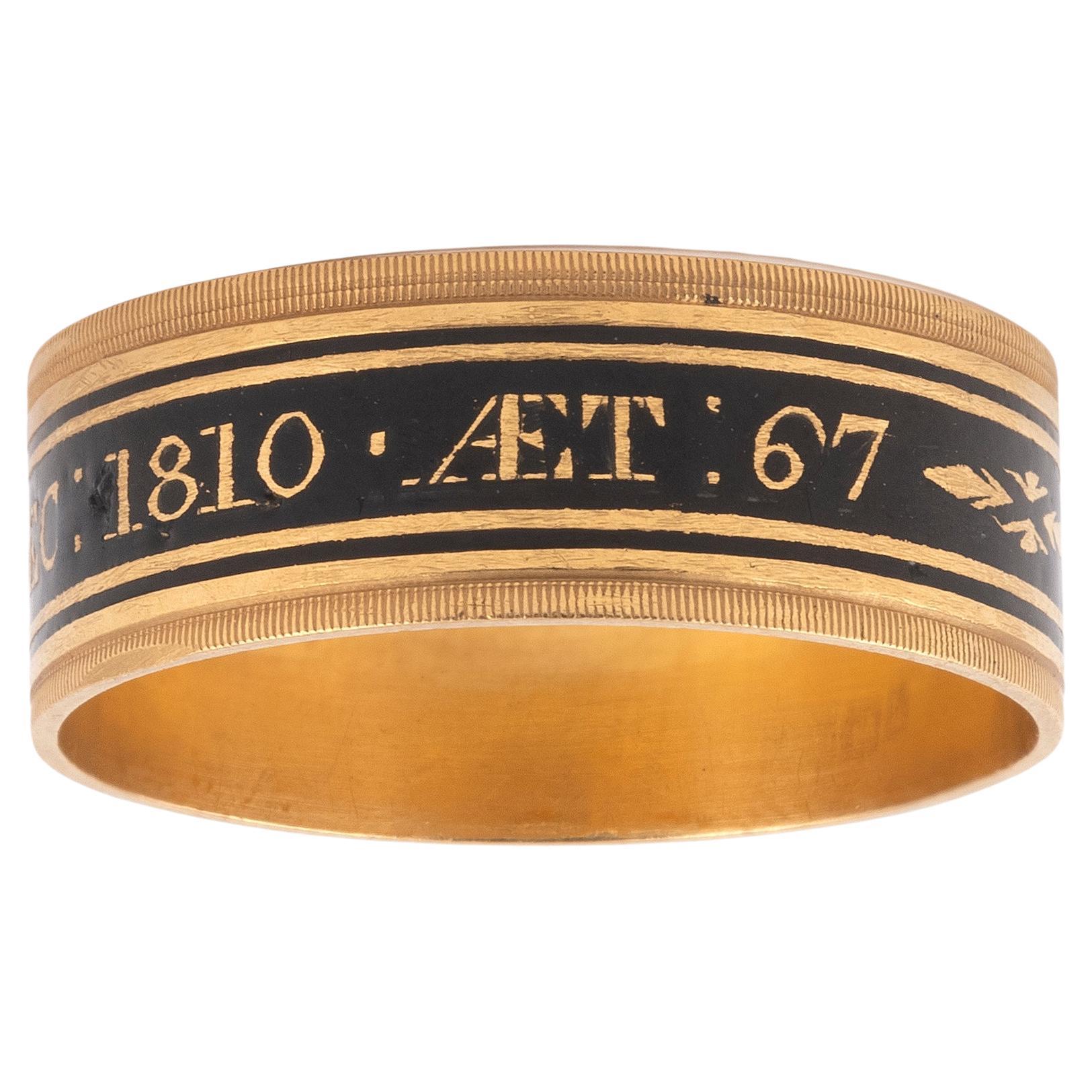Mourning ring, 19th century, probably Matthew Govett, created rings of this style in gold for a range of people in society., circumferential black inscription band with date 1810, 4.75 g, Size 9

M: Milner, who died on the 22st of December, 1810, at