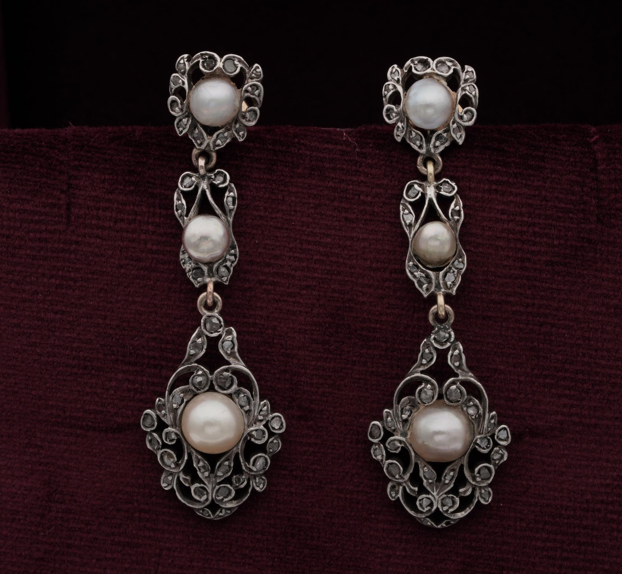Step into History
beautiful pair of long drop earrings – 1800 ca – Hand crafted of solid 18 Kt gold topped by silver
Exquisite minute scroll work like an antique trim, fully enhanced by tiny rose cut Diamonds complementing a trio of Pearls set along