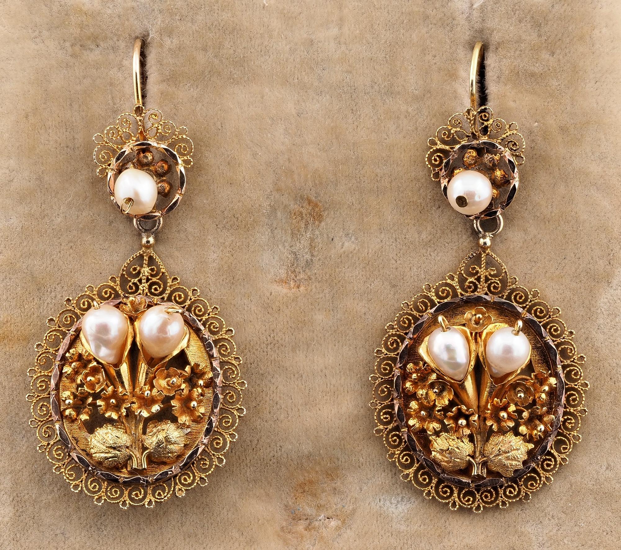 Georgian to Treasure
Quite spectacular in design these antique drop earrings, 18 KT solid gold, hand crafted during the Georgian period , 1820 ca
They are of amazing workmanship, the main panel is a large oval with a centre bunch of flower artwork,