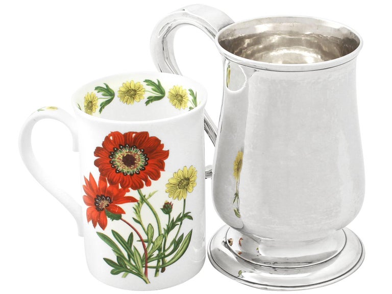 A fine and impressive antique Georgian Newcastle sterling silver pint mug made by John Langlands I and John Robertson I; an addition to our silver wine and drinks related collection.

This fine antique George III sterling silver pint mug has a