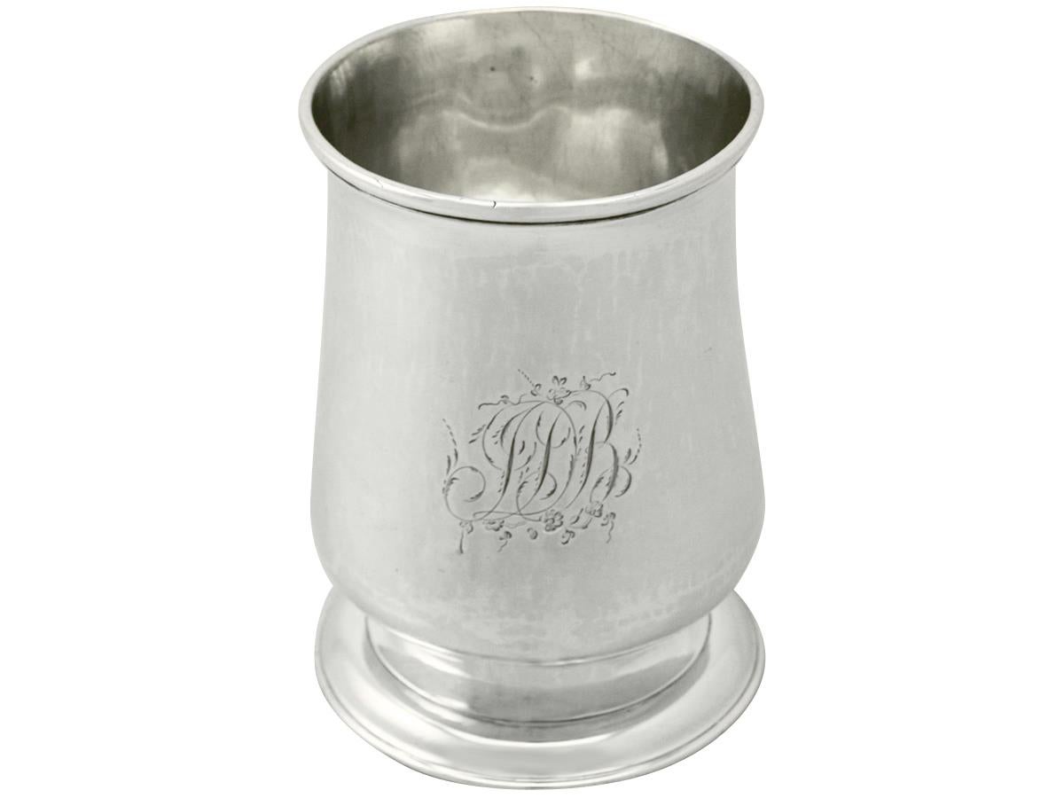 A fine and impressive antique Georgian Newcastle sterling silver half pint/christening mug; an addition to our range of diverse Newcastle silverware.

This fine antique George III Newcastle sterling silver half pint/christening mug has a plain