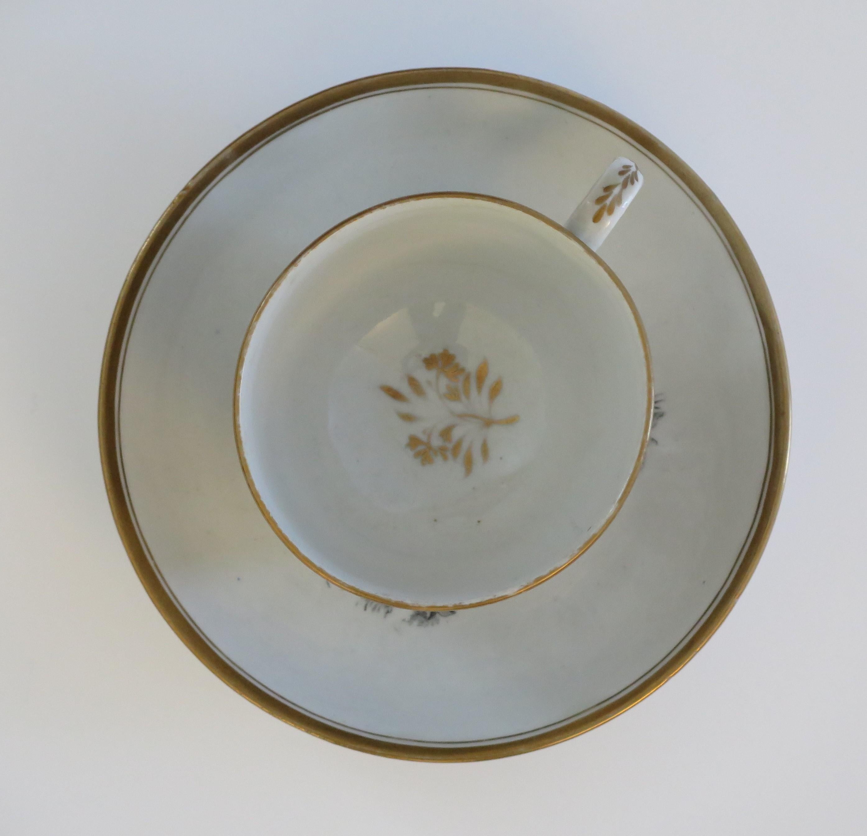 This is a bat printed porcelain Tea cup and saucer, by New Hall, dating to the early 19th century George 111rd period, circa 1805.

Both pieces are well potted, the cup on a low foot with a ring handle.

Both pieces have a bat printed design;