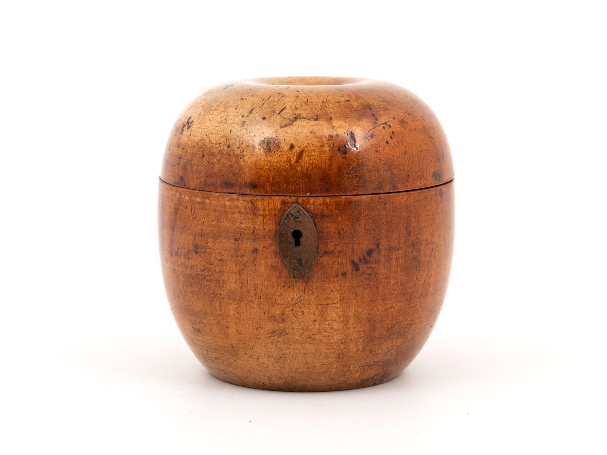 Shaped as an Apple

From our Tea Caddy collection, we are delighted to offer this superb Georgian Apple Treen Tea Caddy. The Tea Caddy carved from Sycamore as a novelty Apple with a button stalk, shaped body and shaped cut steel escutcheon. When