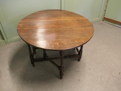 Georgian Oak Gate Leg Table with drawer The table has a solid oak top