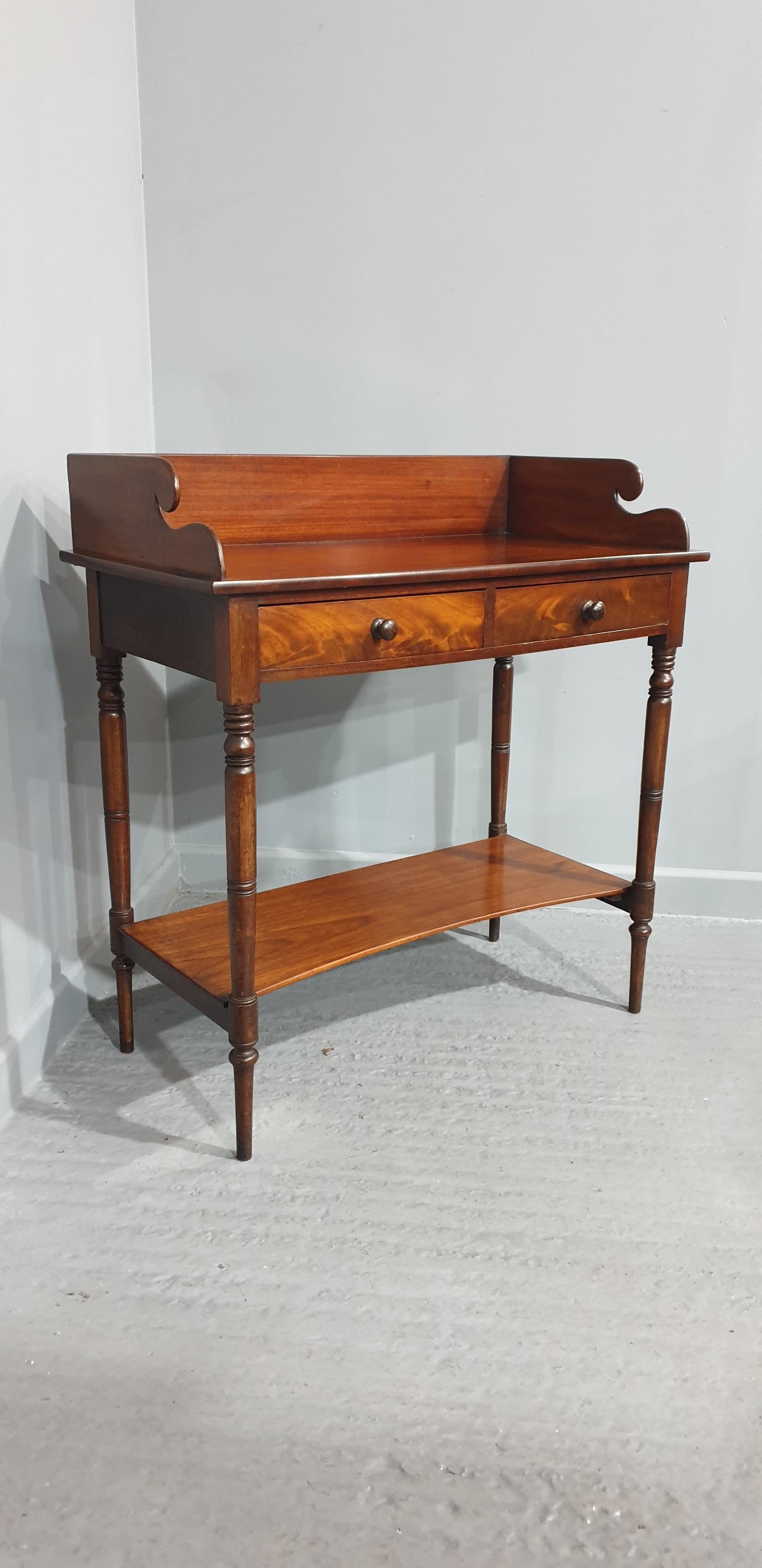 In excellent all round condition, very nice Georgian oak lowboy with unusual pierced detailing, original brass handles, lovely colour
