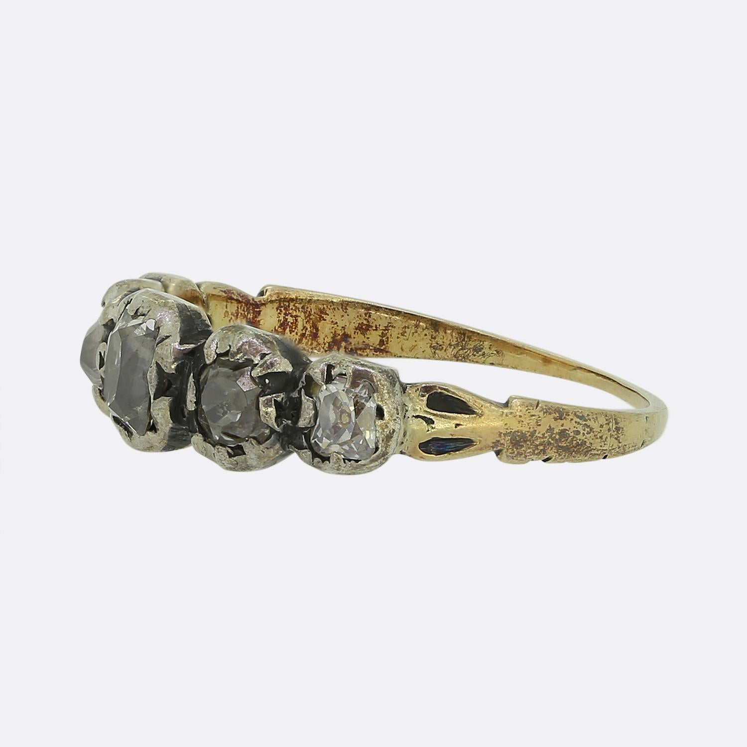 Here we have a truly wonderful Georgian diamond ring. The ring features five chunky old cut diamonds that graduate in size with the largest in the centre. The stones are set in a silver cut down collet setting with a closed back, which was typical