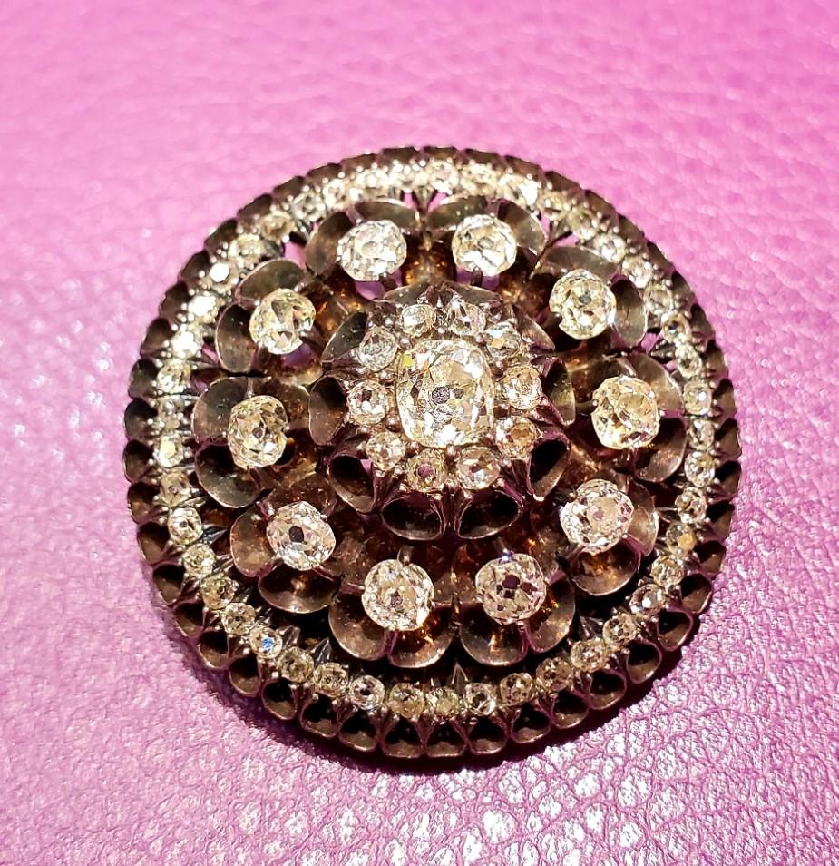 Georgian Old Mine Diamond Brooch

Circa 1830

4.25 ct. of Diamonds, including an Old Mine Cushion cut Diamond in the center weighing approximately half a carat 

Set in gold and Silver

1.25 inches in Diameter
