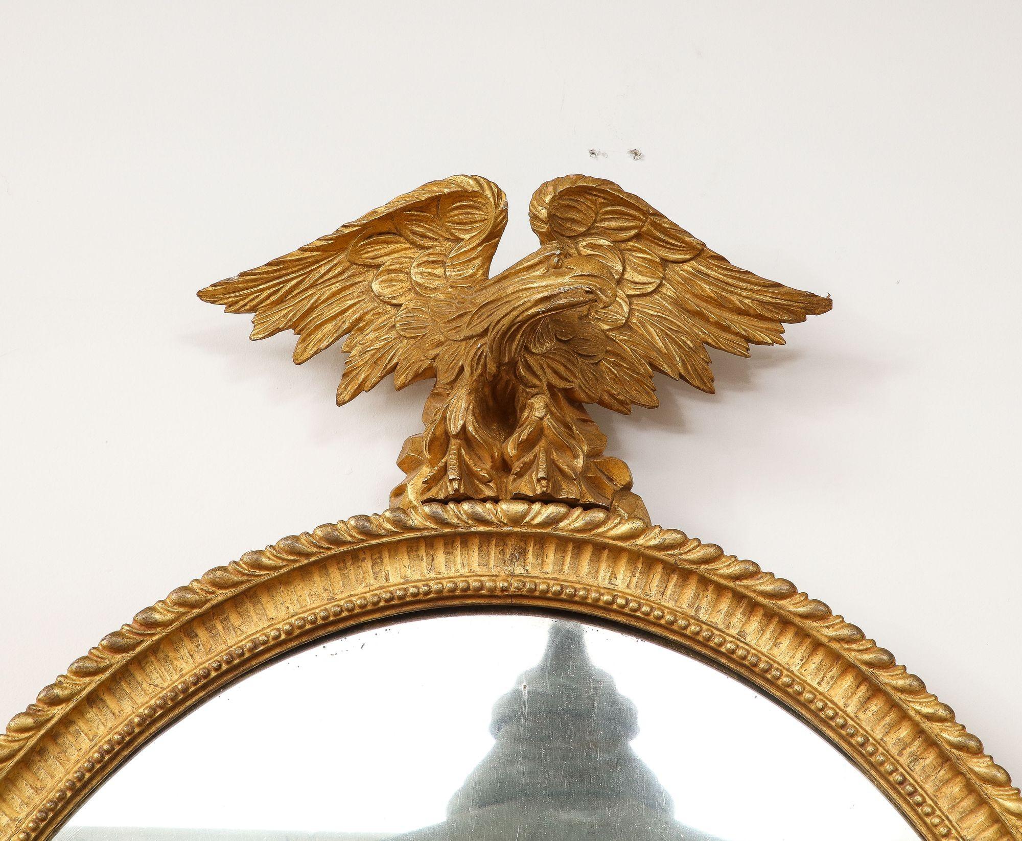 English Georgian Oval Giltwood Mirror with Eagle Crest For Sale