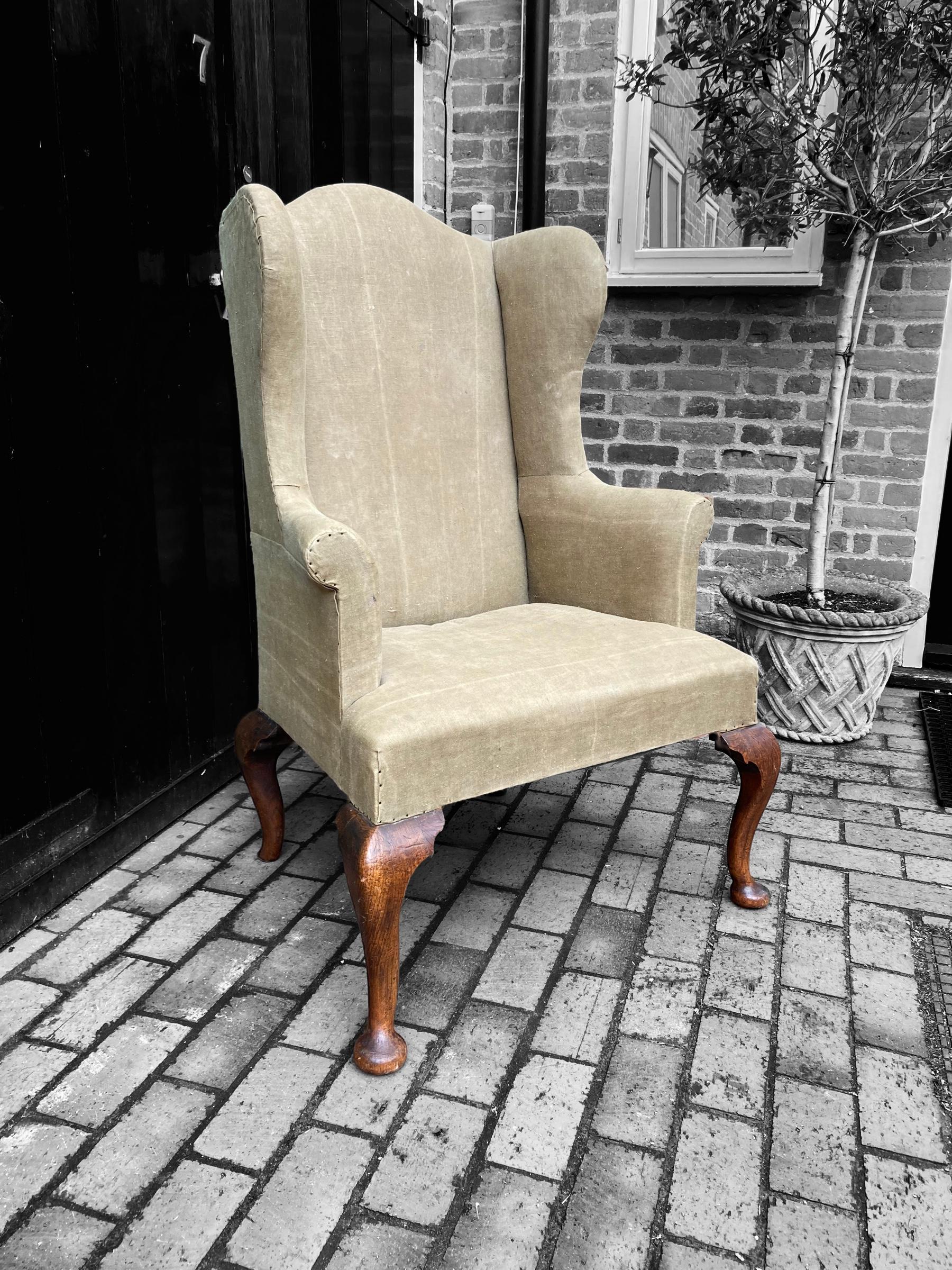 An attractive oversized, large scale Georgian wing back chair featuring elm cabriole legs.
A really attractive piece due to it's large size and shaping. A wonderful statement piece.