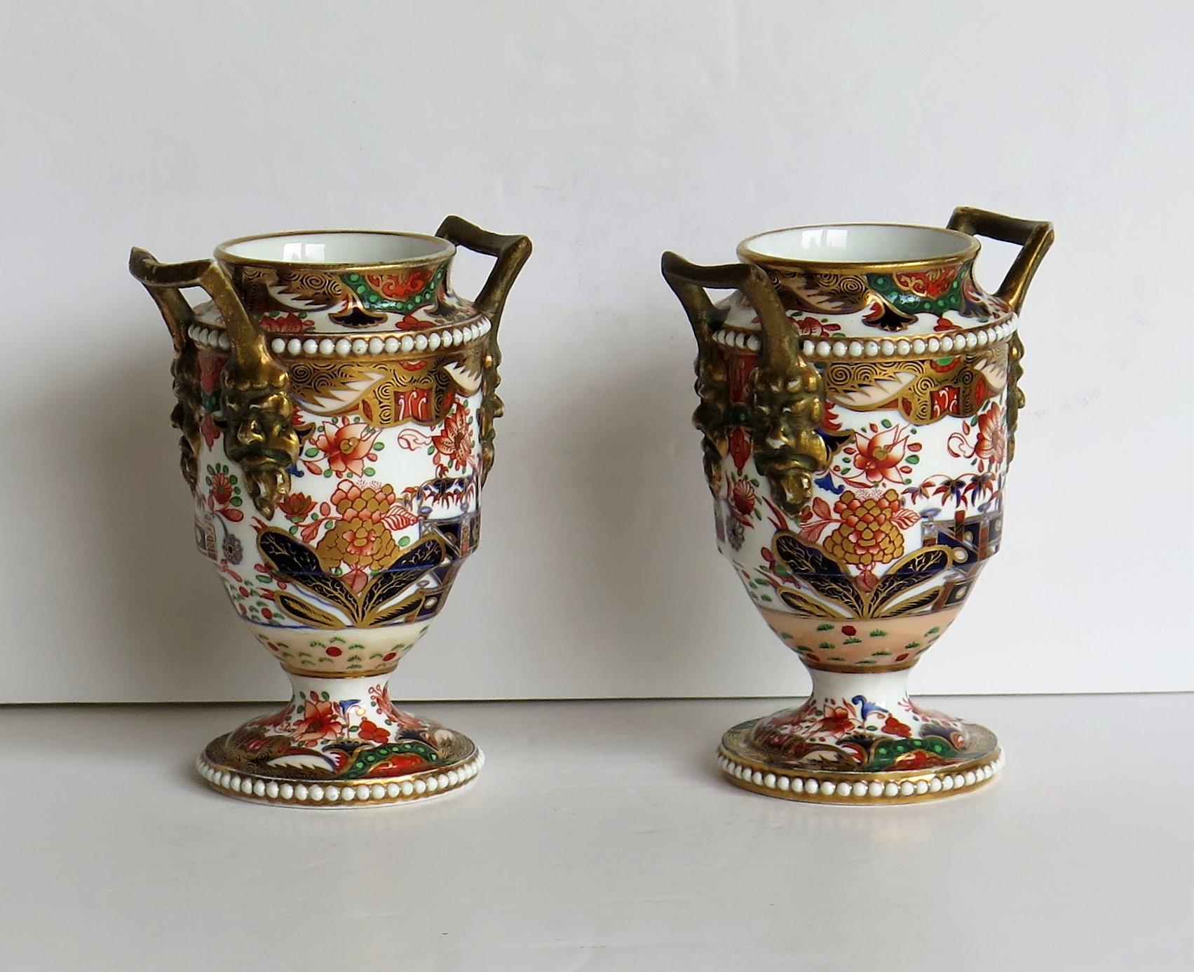 These are a good example of English George III period, Spode porcelain small cabinet vases, beautifully hand painted and gilded in pattern 967 and dating from the early 19th century, circa 1810-1815.

These are a very high quality pair of small