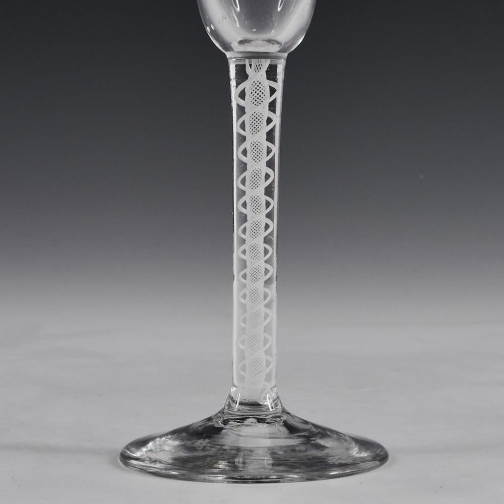 Georgian Pan Topped Double Series Opaque Twist Wine Glass, c1760

Additional information: 
Date : c1760
Period : George II/George III
Origin : English
Colour : Clear
Bowl : Pan-topped round funnel
Stem : Double series opaque twist
Stem Features : A