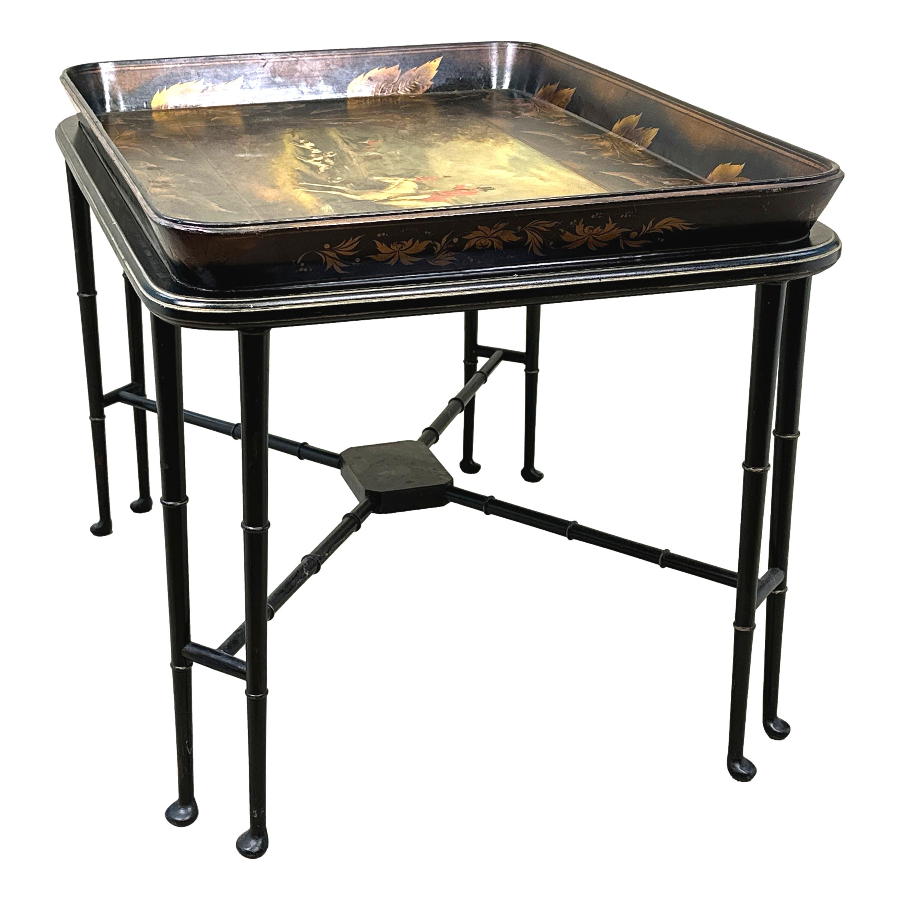 A Delightful Early 19th Century, George III Period, Papier Mache Rectangular Tray Having Black Laquered Background With Hand Painted Hunting Scene And Floral Decoration, House On Attractive Later Stand With Double Faux Bamboo Legs And Turned Pad