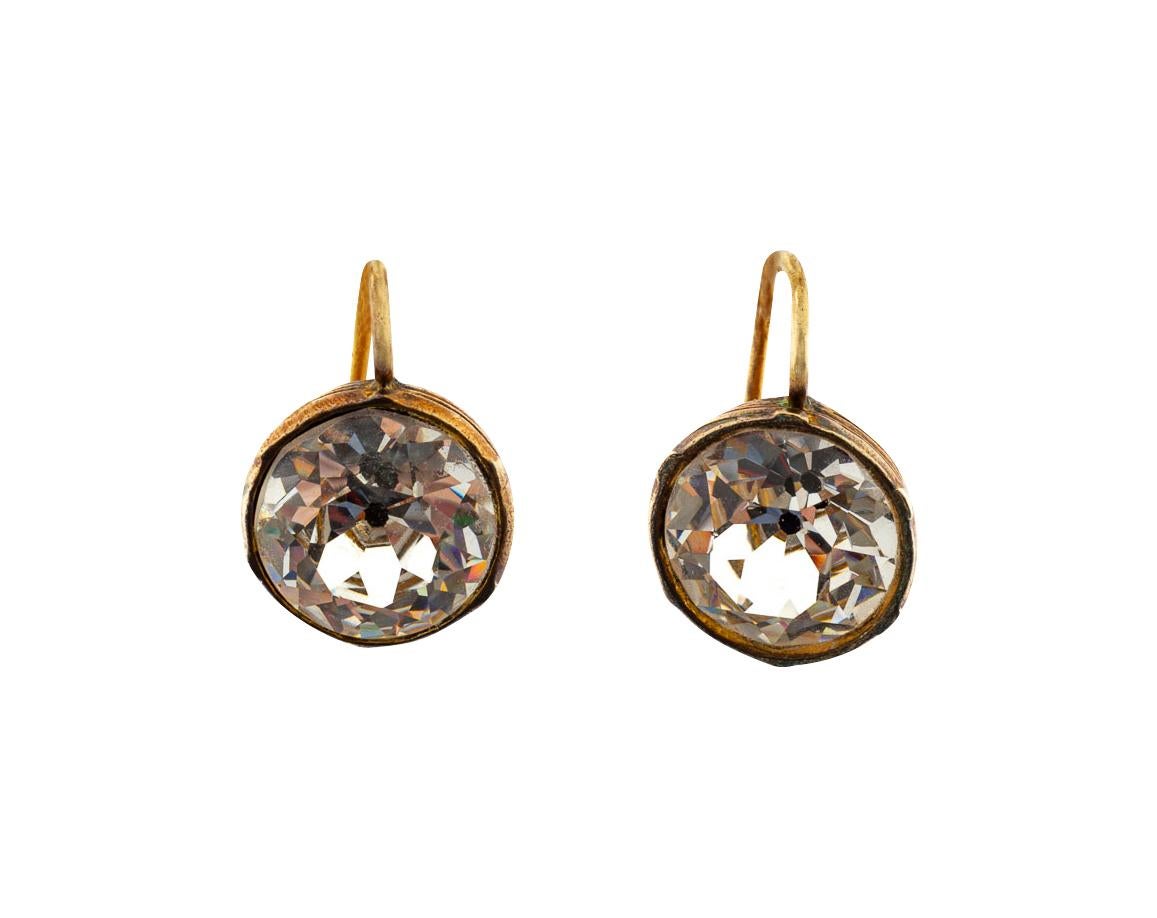 A vibrant pair of paste earrings are collet set rather than most which are rub over or pie crust settings. The collet setting exposes the entire face of the stone. The photos show the many facets in the pastes. You can imagine the brilliance. The