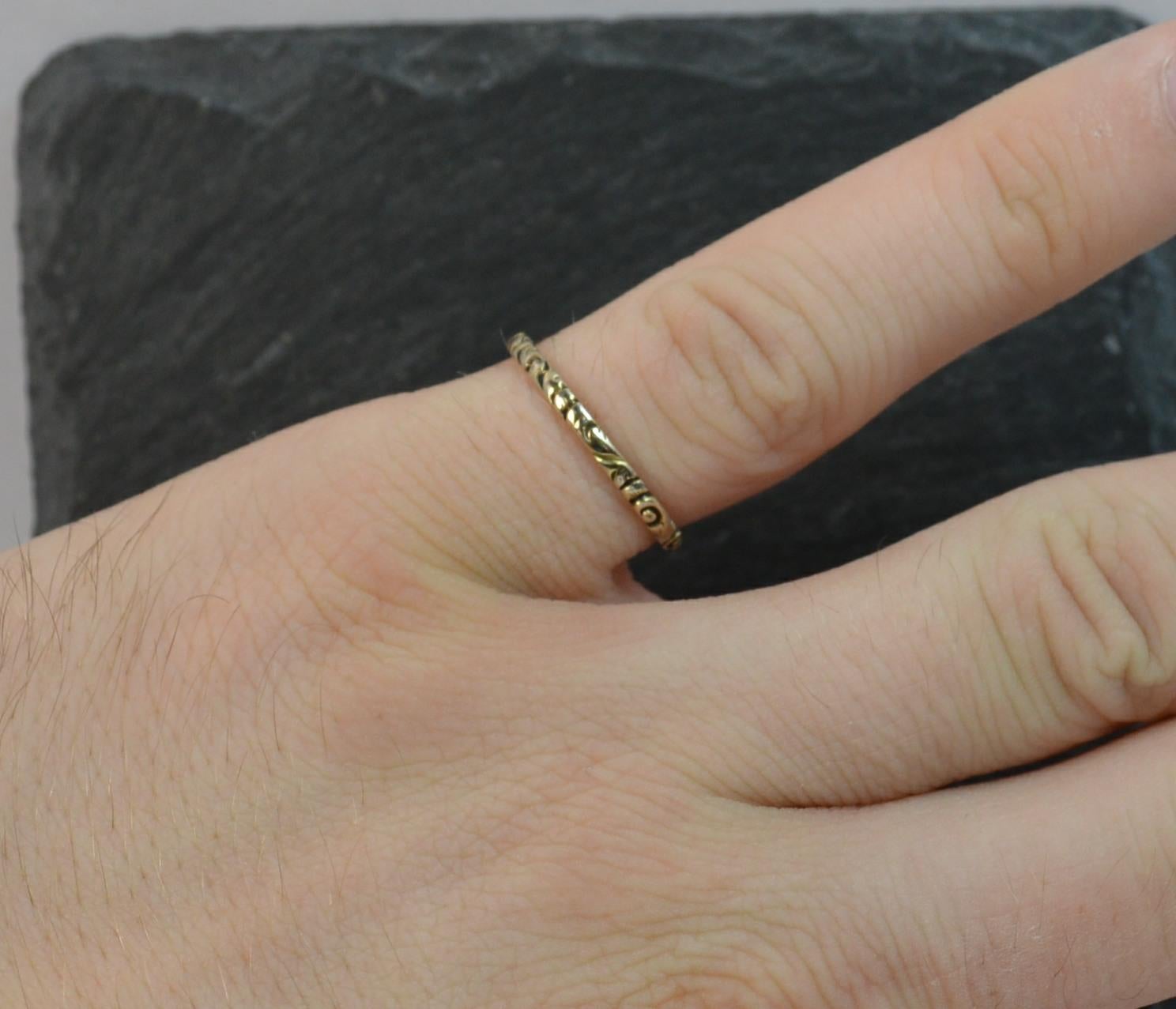 A genuine Georgian III period stack band ring. Solid gold example. Deep floral relief throughout. 1.6mm wide. c1760. SIZE ; K 1/2 UK, 5 1/2 US

CONDITION ; Good for age. Crisp pattern. Clean example. Please view photographs.
WEIGHT ; 0.7