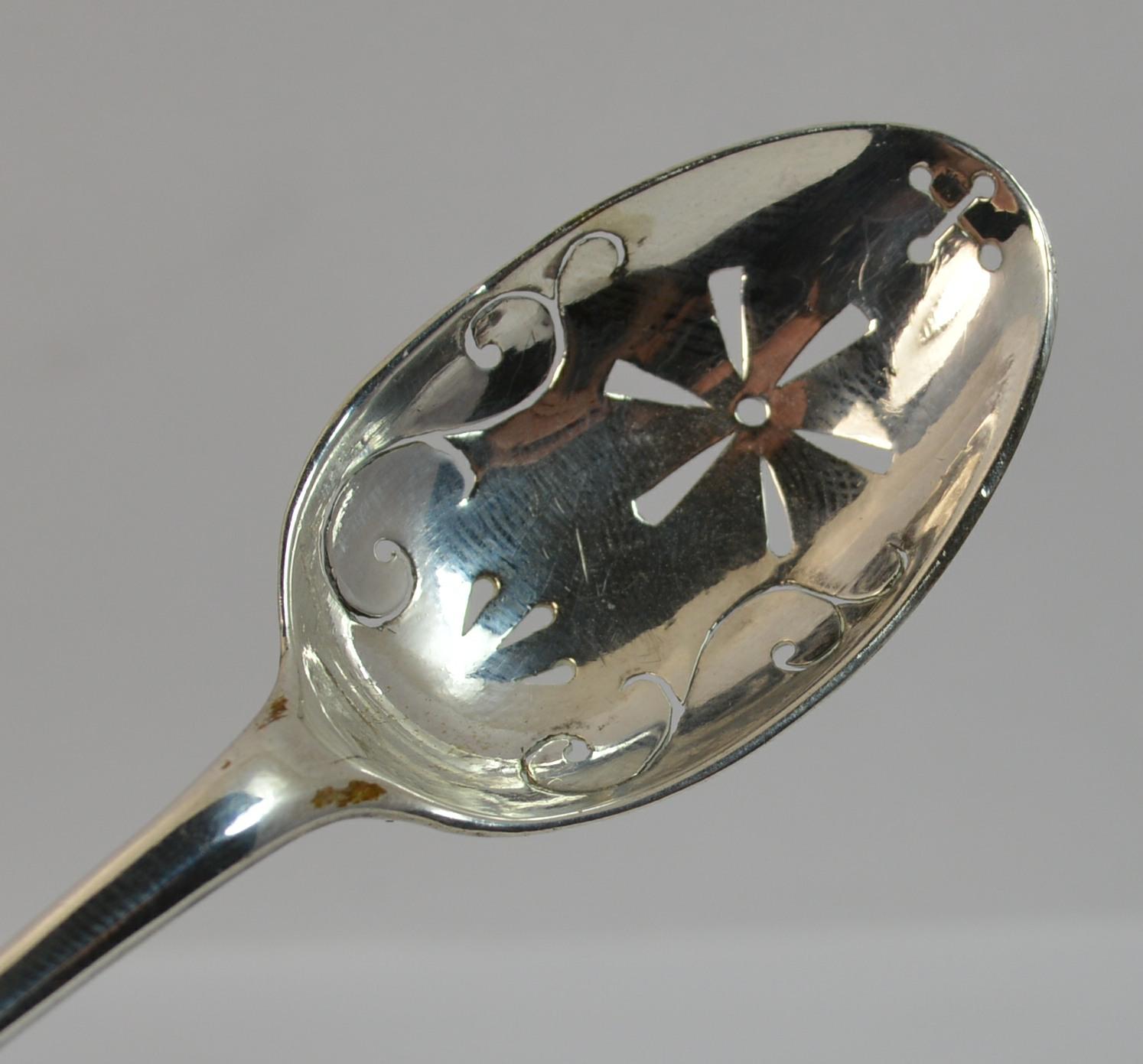 A rare Georgian period solid silver mote spoon. Attractive piece. Pierced bowl. 

Hallmarks ; none, tests as silver
Weight ; 9.9 grams 
Size ; 13cm long, 24mm x 41mm bowl
Condition ; Very good for age. No repairs. Light wear. Issue free. Please view