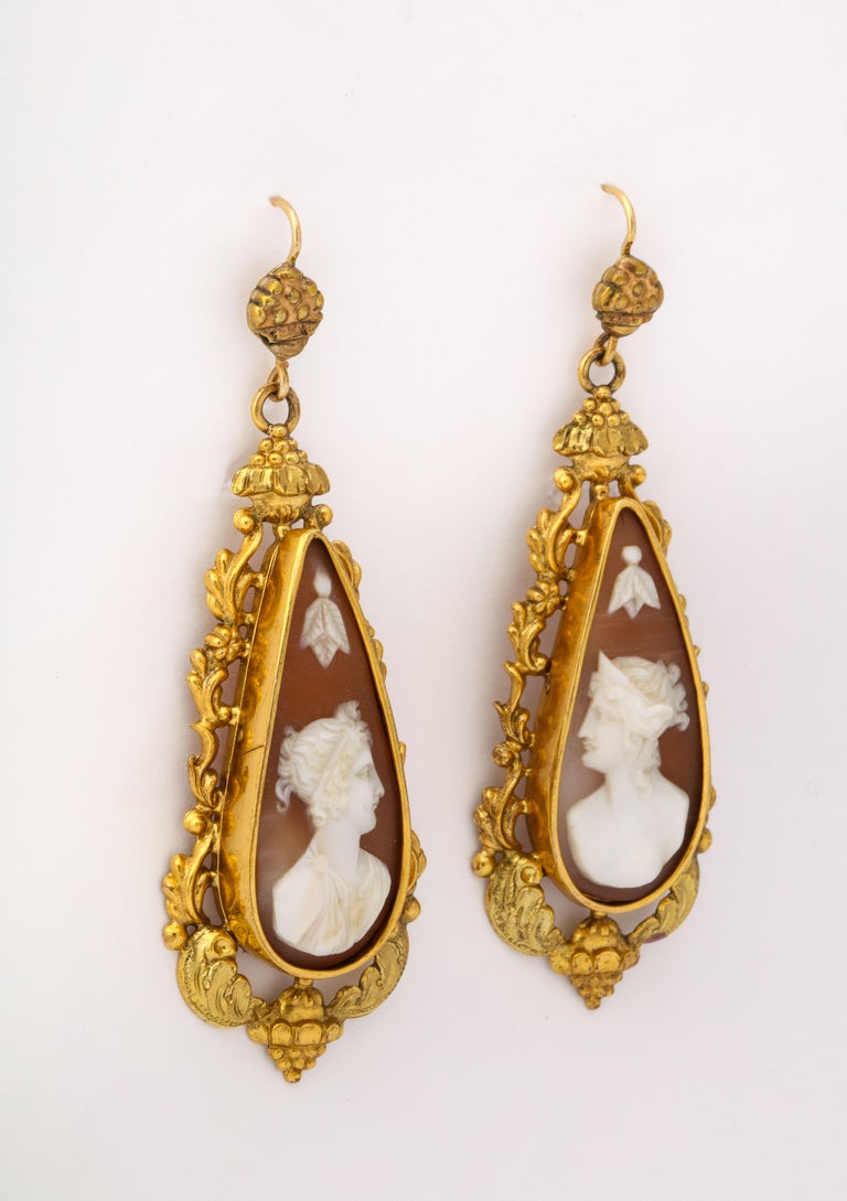 The rare, collectable metal, Pinchbeck, is the setting for 18th century shell cameos of a male and female god and goddess. The earrings are all original including the tops and after more than 200 years are in perfect condition. Typical of Georgian