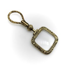 Georgian Pinchbeck Quizzing Glass with Floral Motif and Swivel Handle
