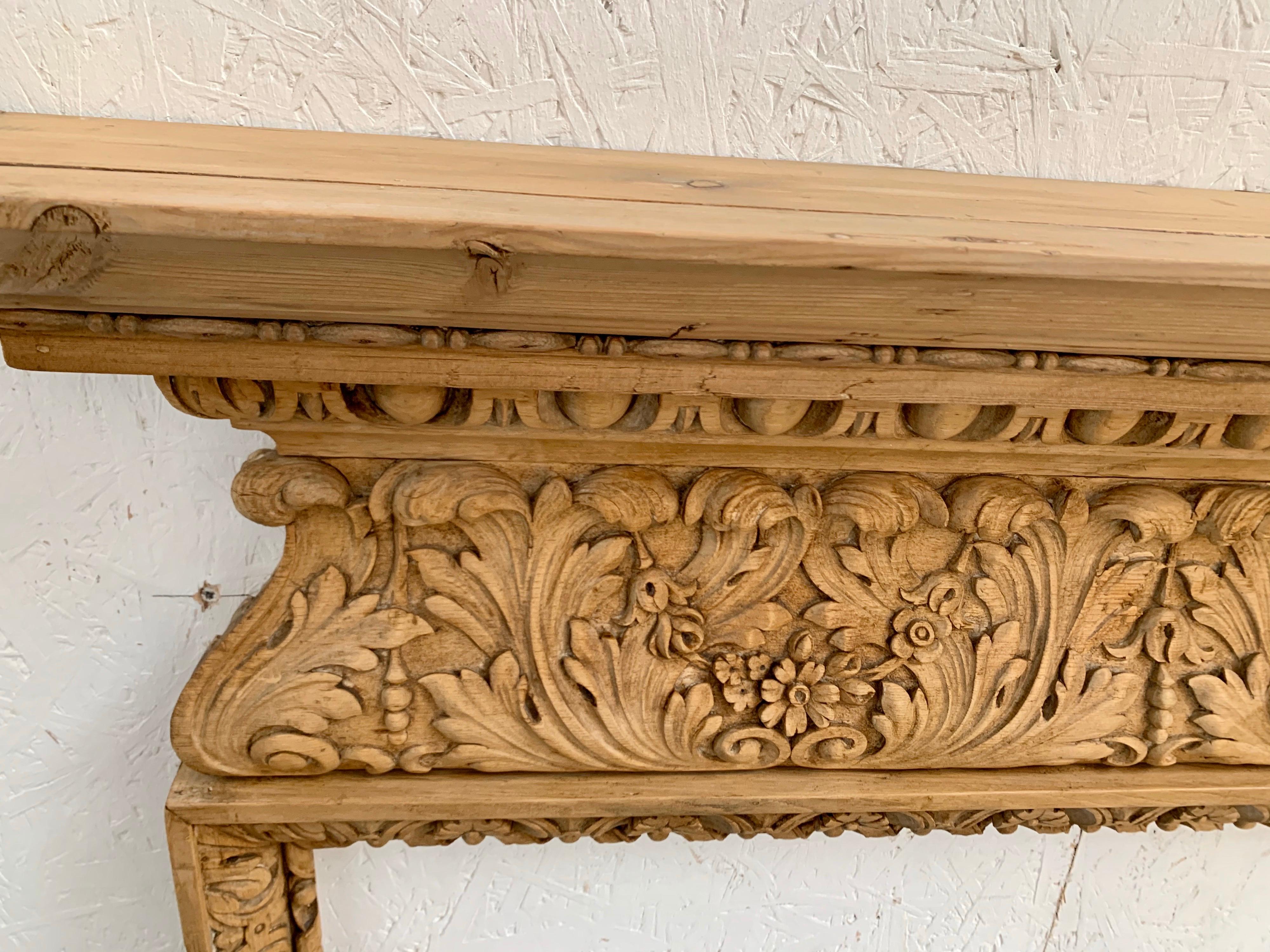 An exceptional elegant hand Georgian pine fireplace surround.
Recently salvaged from old English manor barn.
Very fine detailed legs and wildly carved frieze depicting delicate foliage, egg and dart mouldings and acanthus leaf carvings.
A truly