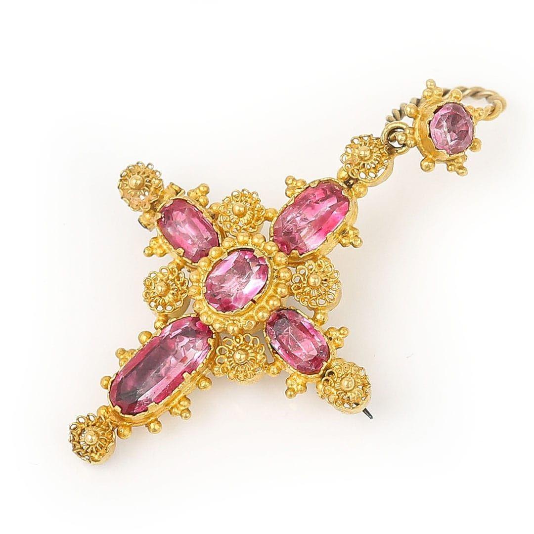 A truly stunning foiled back pink topaz cannetille cross pendant and brooch dating from the early 19th century. The highly ornate cross dating from circa 1830 has all the elements that Regency jewellery is recognised for and sought after. 
 
A