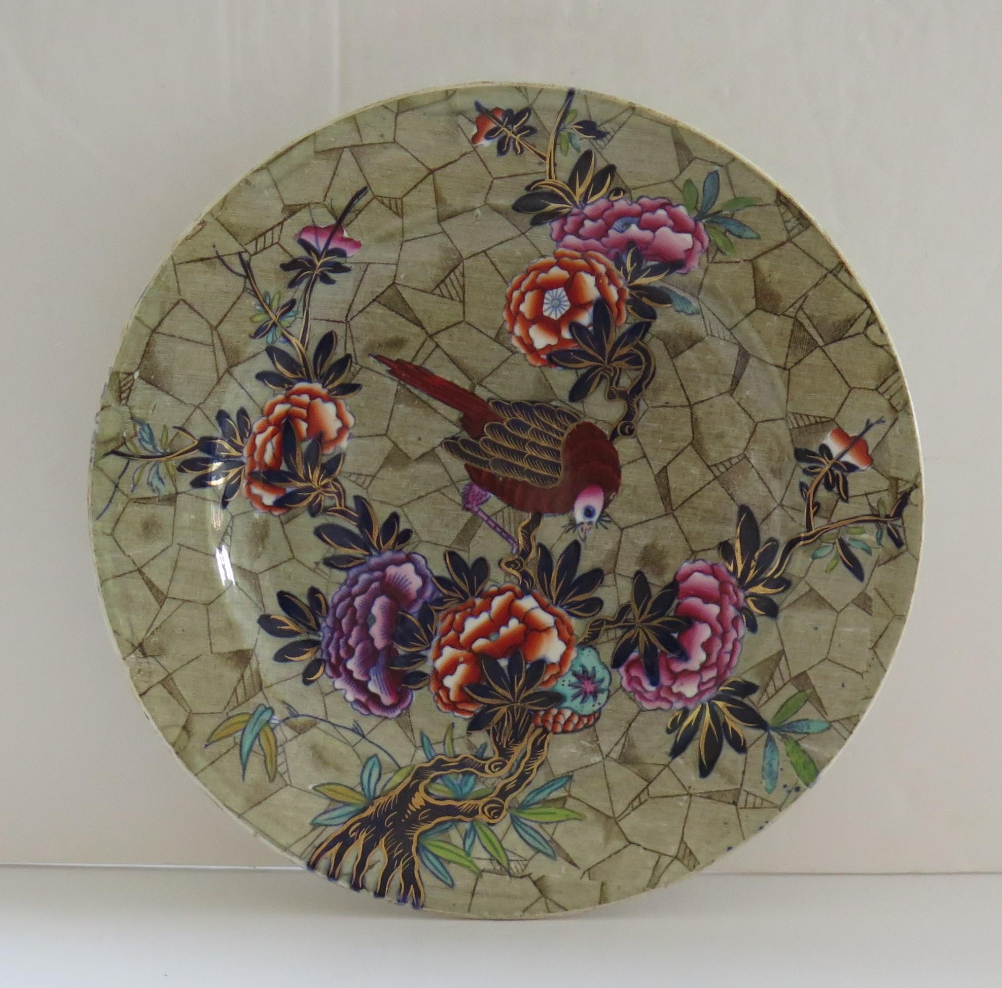This is a beautiful plate in the Tumbledown Dick pattern, produced by the Spode factory and made of a type of earthenware pottery called Pearl-ware, in the early 19th century, circa 1825.

The pattern is called 