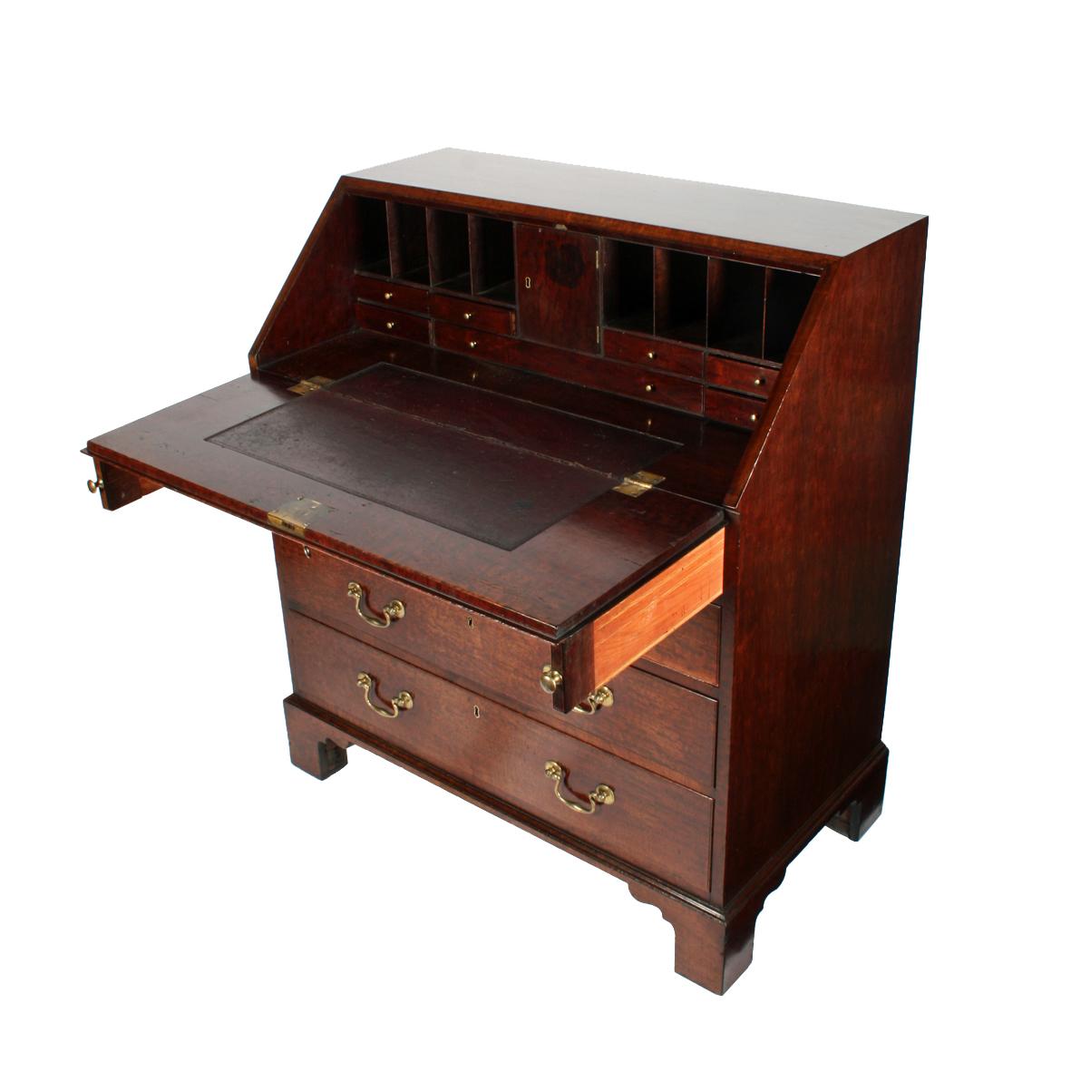 An 18th century Georgian bureau made from the finest 'Plum Pudding' mahogany.

The bureau has two short drawers over three graduated long drawers with original brass swan neck handles and solid oak linings.

The interior has a leather covered
