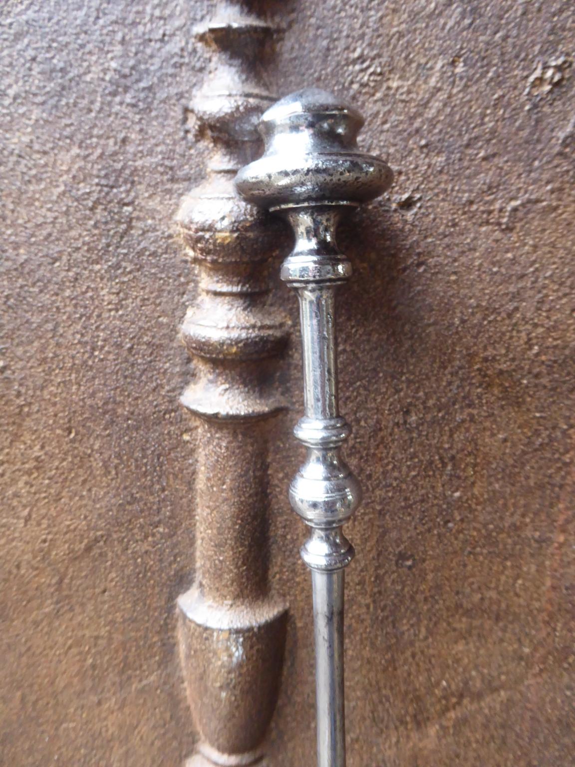 18th-19th century, English fireplace poker made of polished steel.








