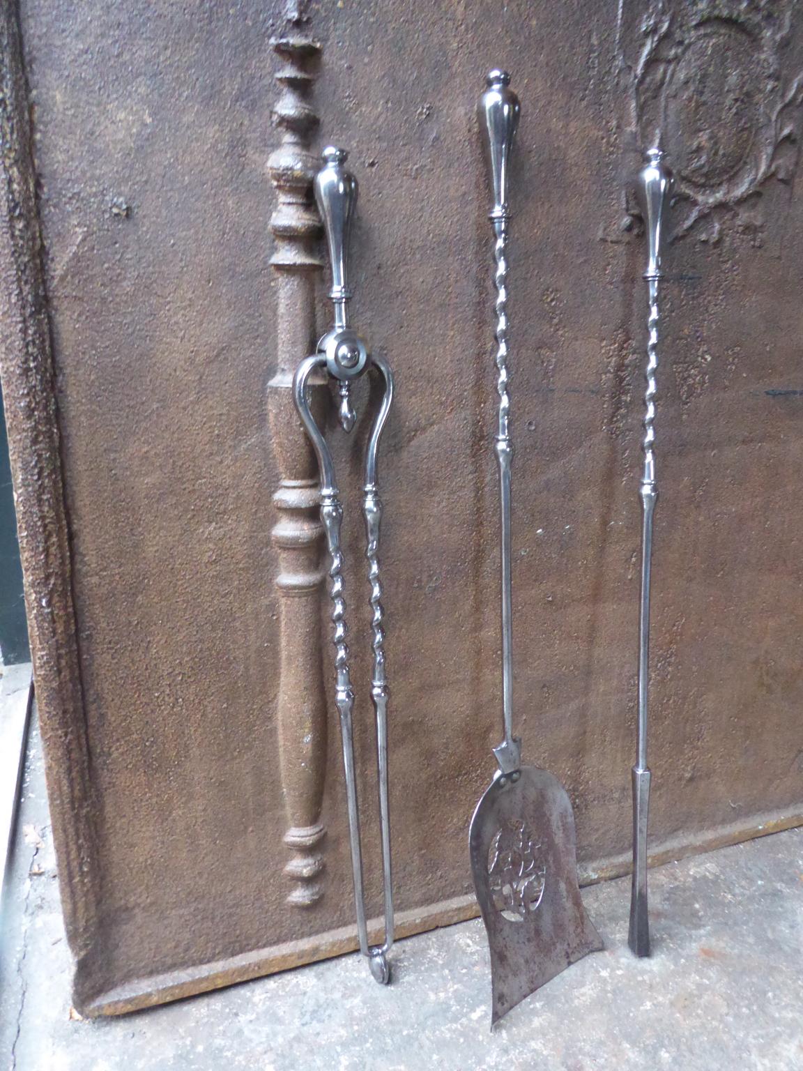 Beautiful set of three Georgian fireplace tools made of polished steel. Each with barley twist shafts
and with a finely pierced and cut shovel in a floral design, 18th-19th century. The fire tool set is in a good condition and is fully
