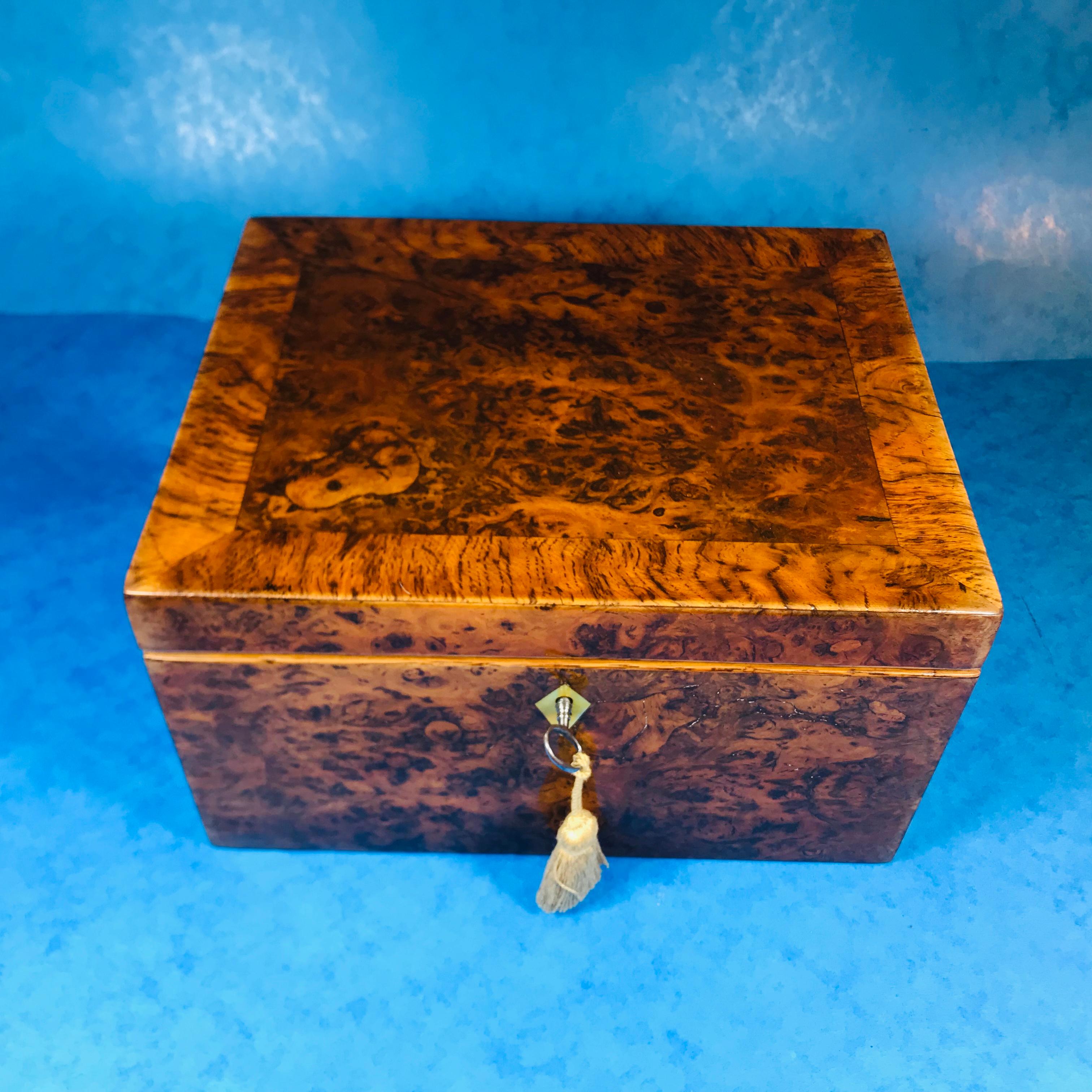 Georgian Pollard oak jewelry box.
The jewellery box is in superb condition, it’s such a wonderful piece of wood. Dating back to circa 1820 the box is crossbanded with a mother of pear key escutcheon. It features a working lock and key.
The box