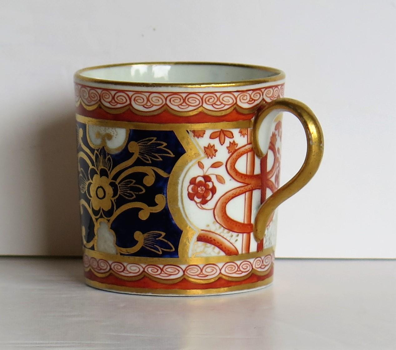 This is a beautiful English coffee can, hand painted in the distinctive Dollar Pattern, which we attribute to Spode, pattern number 715 and dating to the George-III period, of the very early 19th century, circa 1805.

This coffee can is nominally