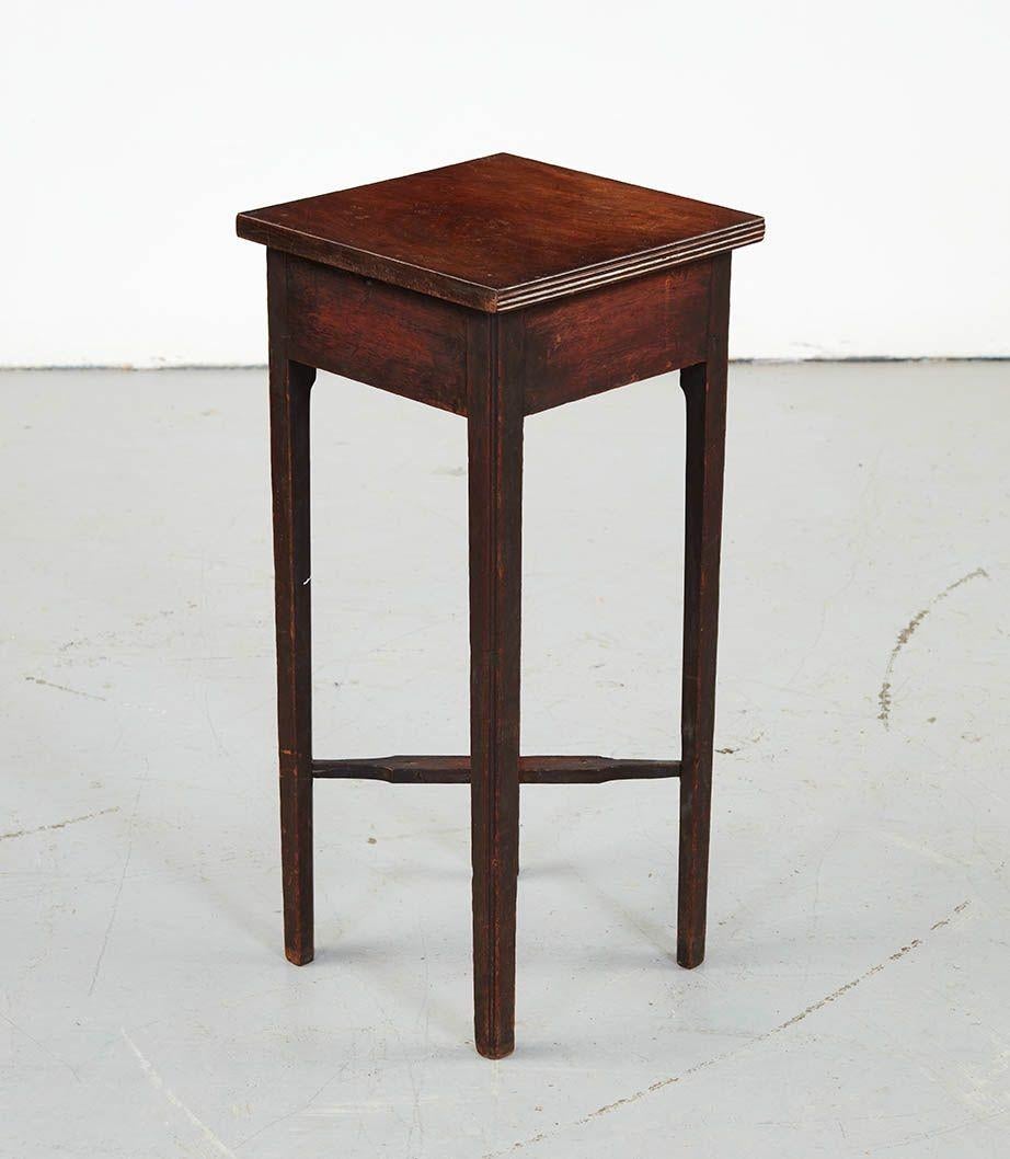 18th Century padouk square single drawer table, the single plank top with reeded edge over single drawer bearing original brass hardware and standing on square legs joined by turned flat 