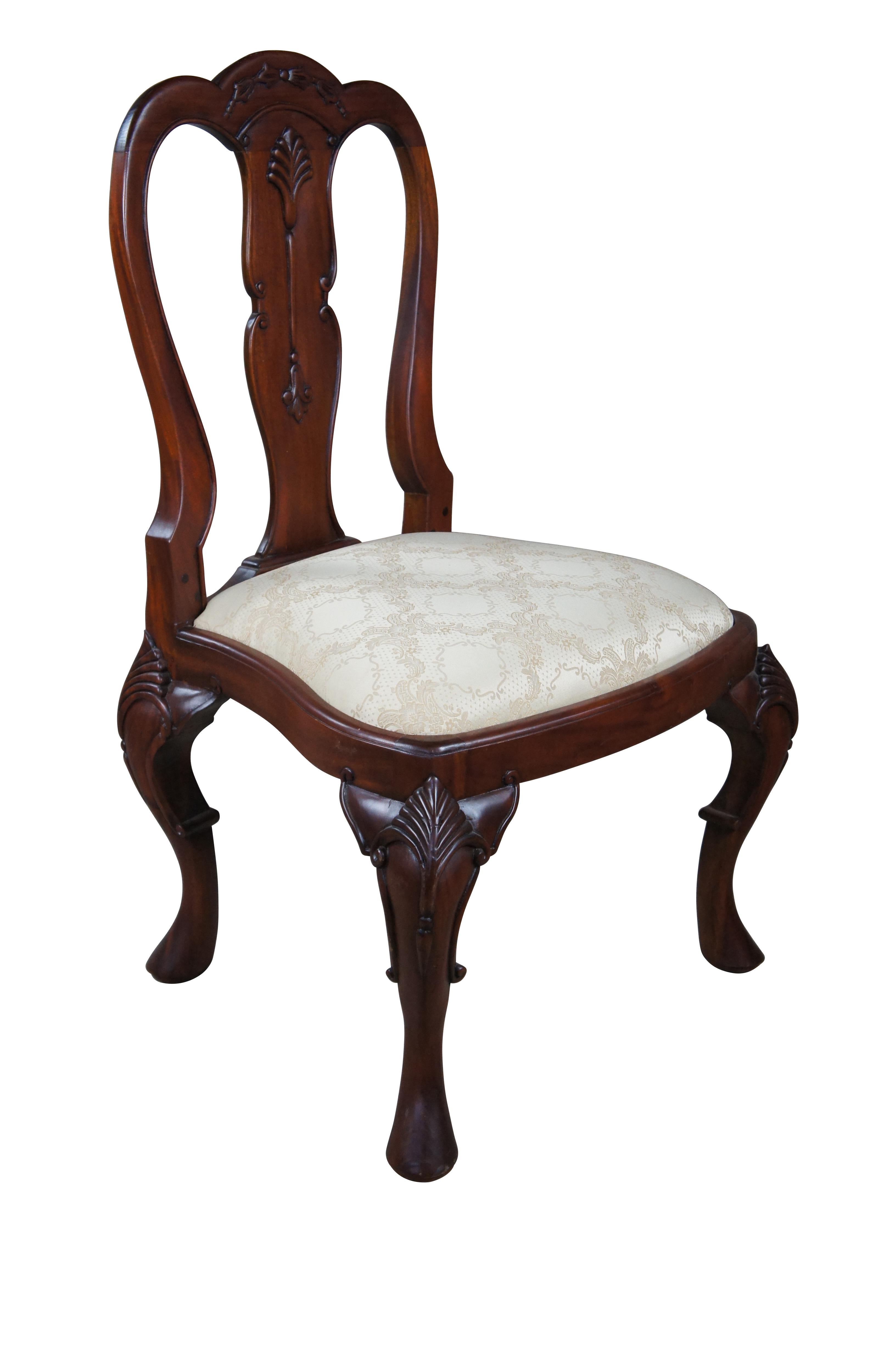 An ornately carved mahogany Georgian style side chair.  Features a carved back splat, silk brocade seat and pronounced cabriole legs with scalloped knees.

Dimensions:

25