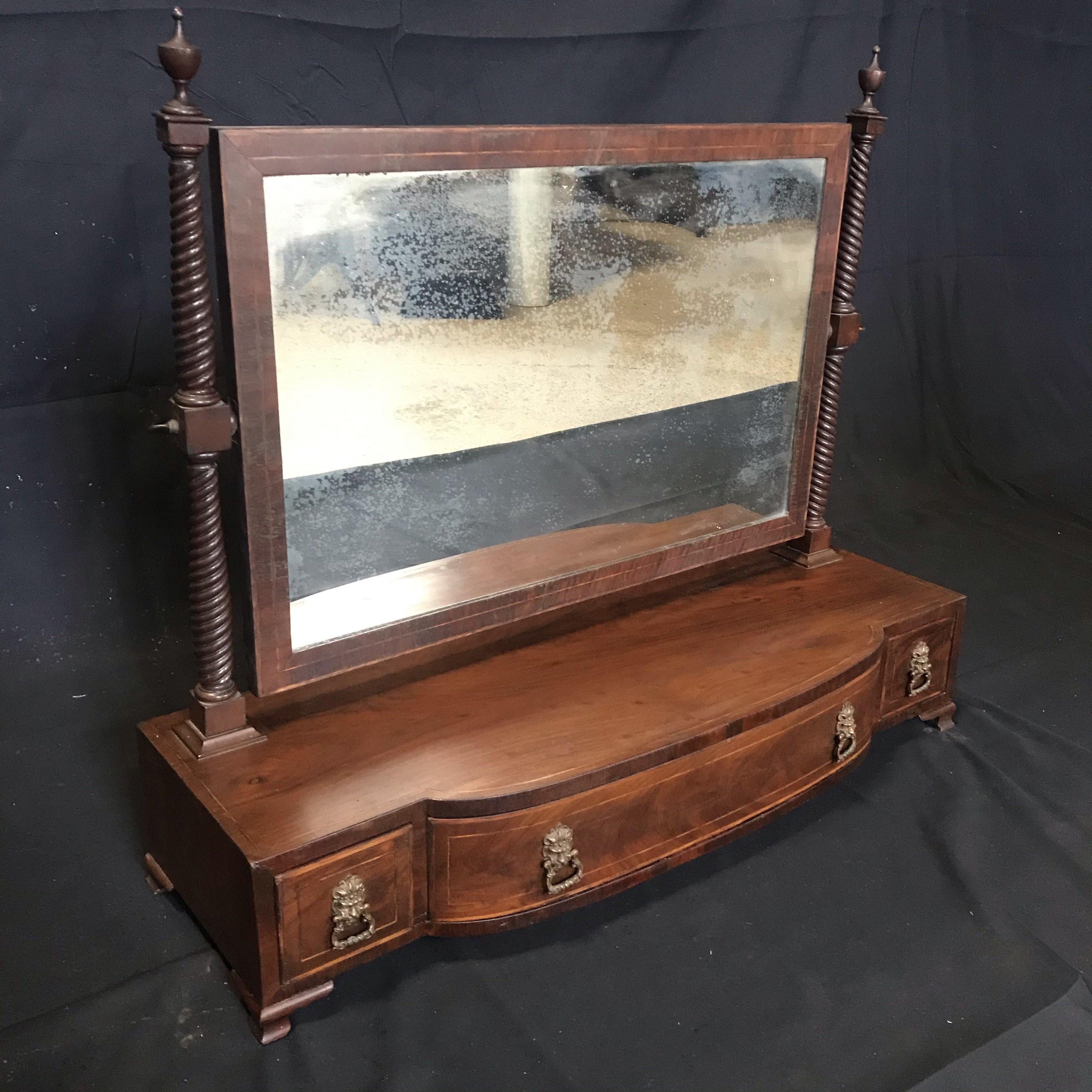 Antique Georgian Regency inlaid mahogany swing dressing table or toilet mirror with stunning lion head pulls and barley twist mirror supports. This is a lovely mirror, full of age and charm, with great proportions. The drawers slide freely and the