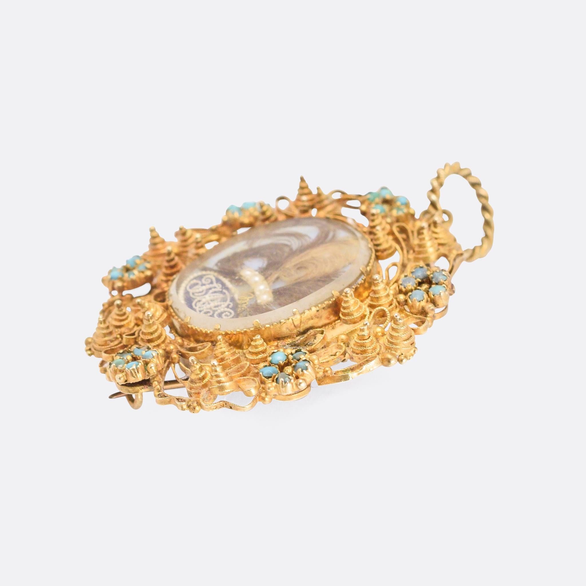 A superb Regency Period locket pendant with a fine filigree and cannetille goldwork border, as well as six turquoise-set Forget Me Not flowers. The central locket compartment is home to hairwork, embellished with tiny pearls that make up the