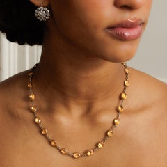 Georgian Revival 15 Karat Yellow Gold and Natural Topaz Rivière