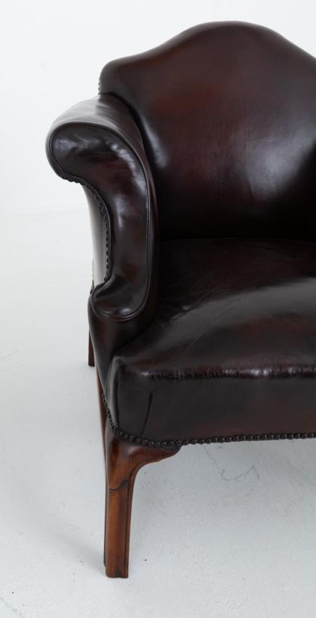 Pair of Georgian Revival leather club chairs.
Circa 1880
William IV
These chairs re raised upon fluted and carved legs
The chairs feature typical Georgian swept arms and a camel back
Will ship to anywhere in the world including US - please get in