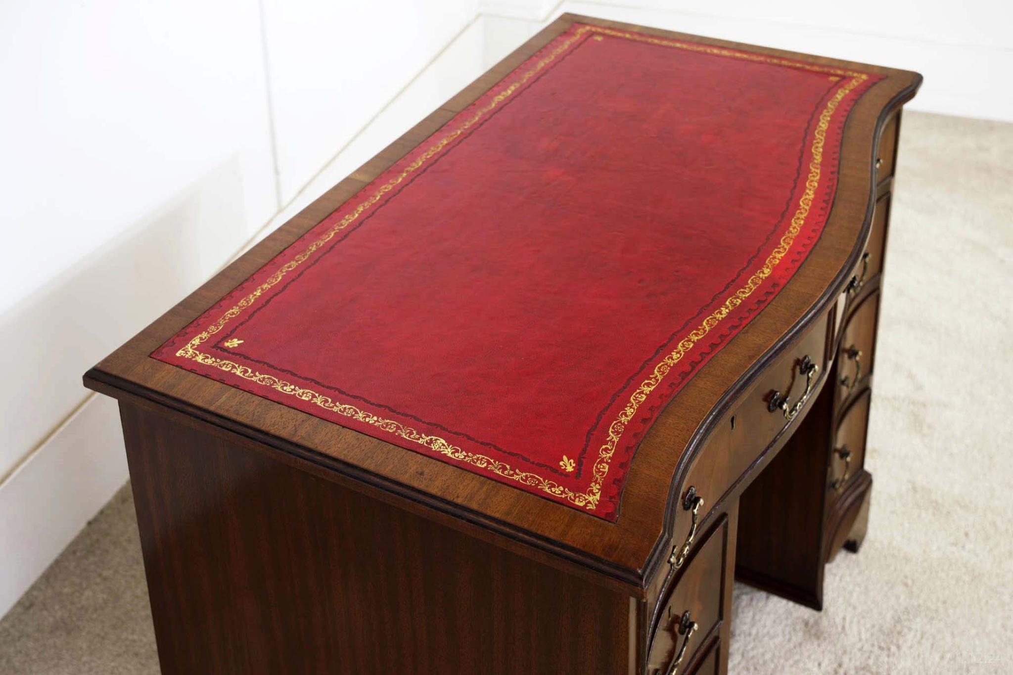 You are viewing a gorgeous Georgian style knee hole desk in mahogany
Top is finished in red leather with gilt embossed and this has just been refinished
Circa date 1920
Plenty of storage with the eight drawers to the front
Great patina to the