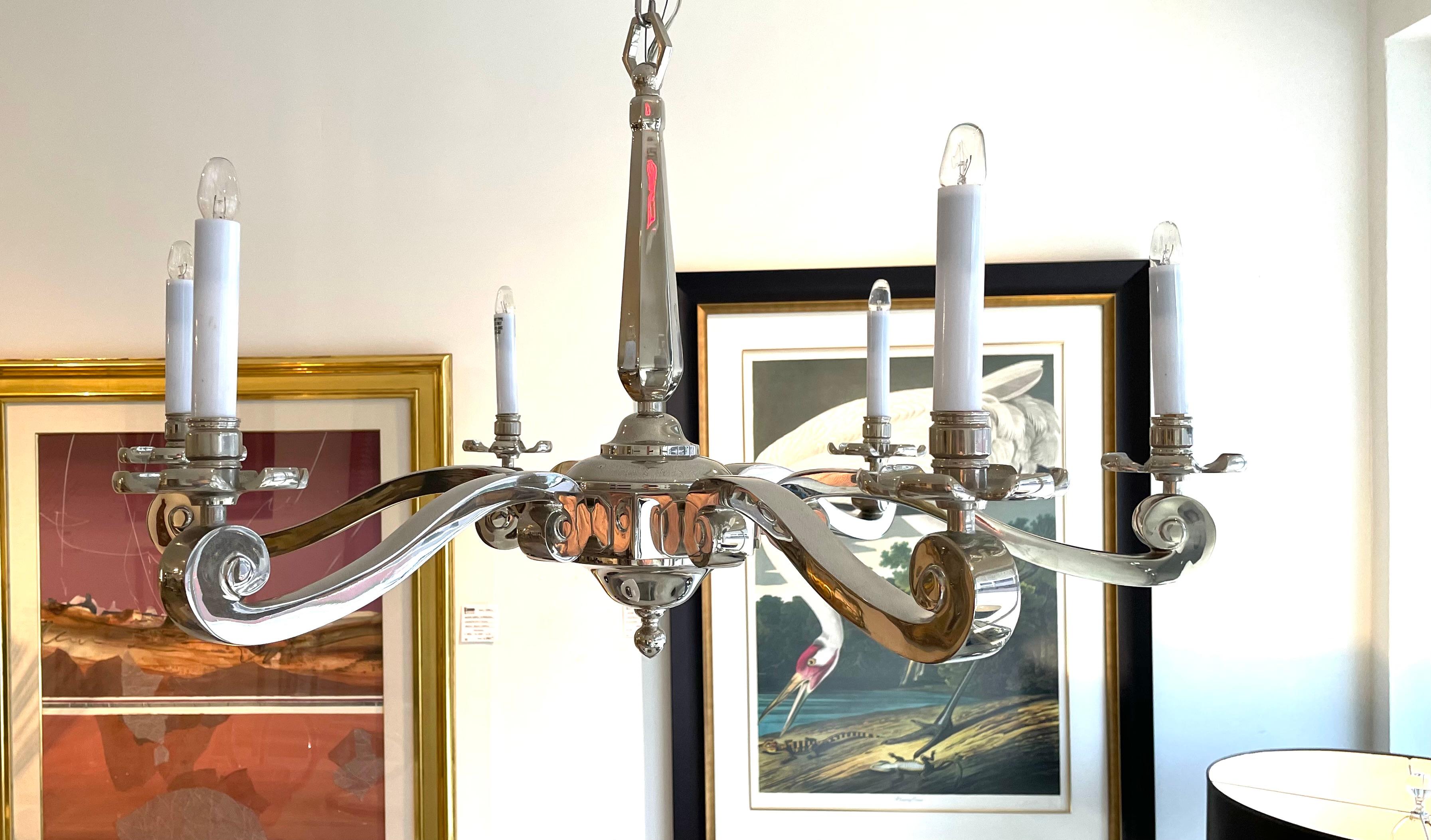 This stylish and chic Georgian Revival style chandelier will make a statement with its form and use of materials. The nickel plating gives the piece a modern take on a traditional form. 

Note: Overall height including the chain and canopy just at