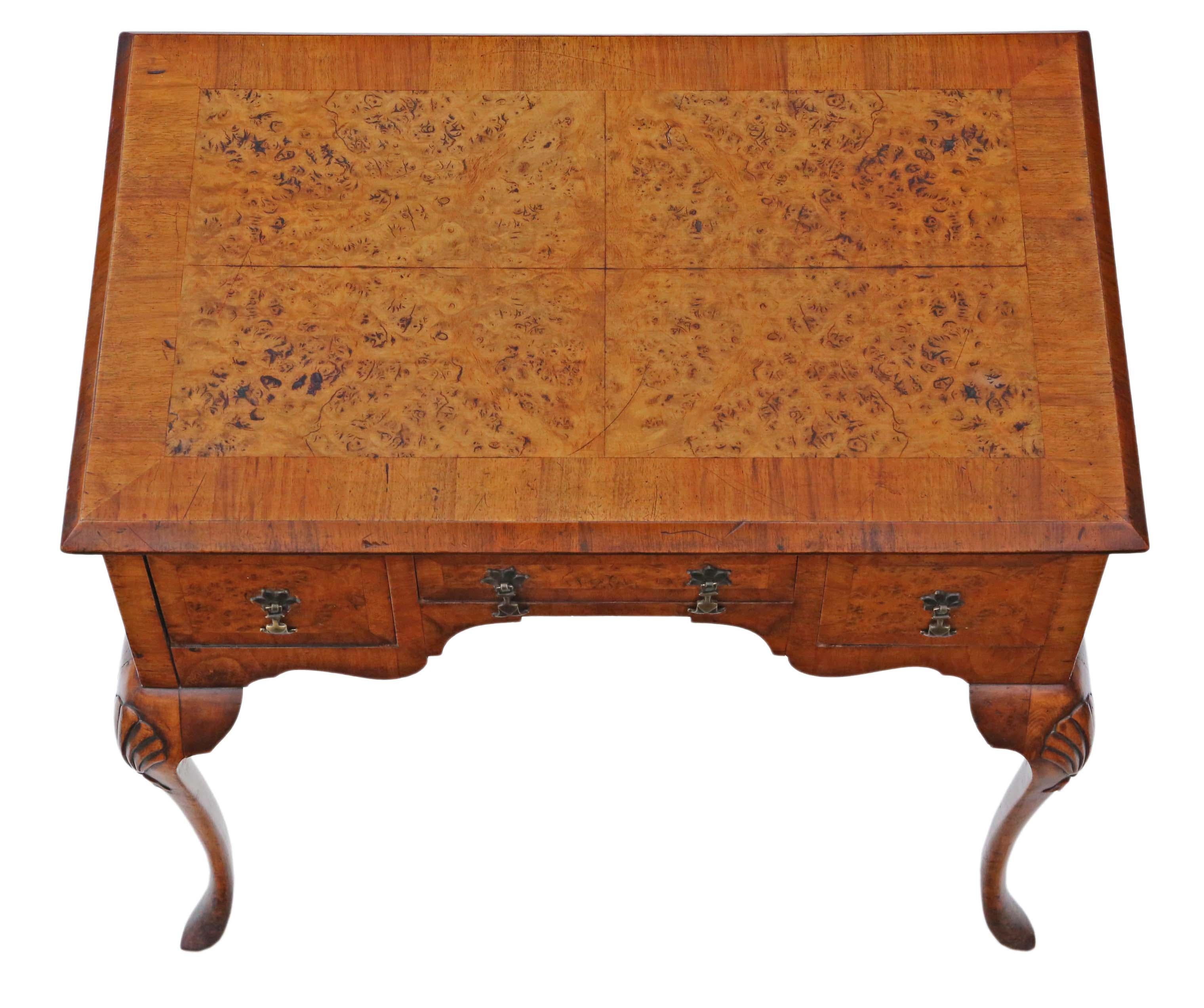 Crafted around 1920, this walnut lowboy serves as a versatile piece—suitable for use as a writing, side, or dressing table—a fine example of Georgian revival design.

Robust and stable, it exhibits no wobbly joints. Brimming with age-induced