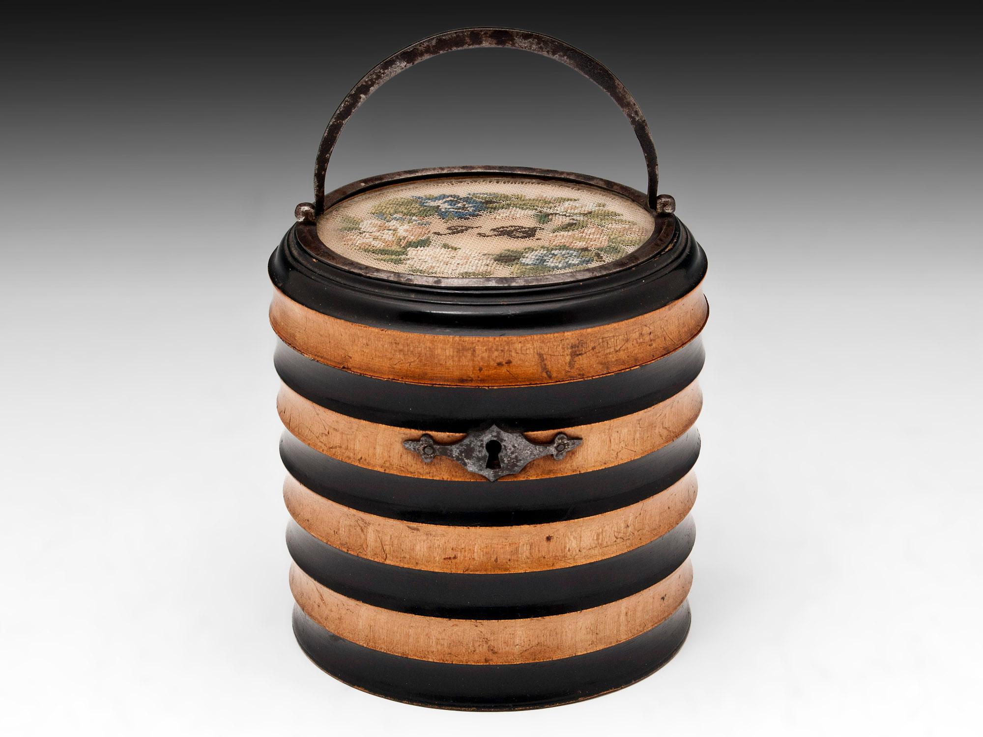 Rare and unusual George III tea caddy in the form of a ribbed bucket. 

The tea caddy of beautiful shape with a ribbed exterior carved from alternating panels of plain Sycamore and Ebonised Sycamore. The looping swing handle of the caddy