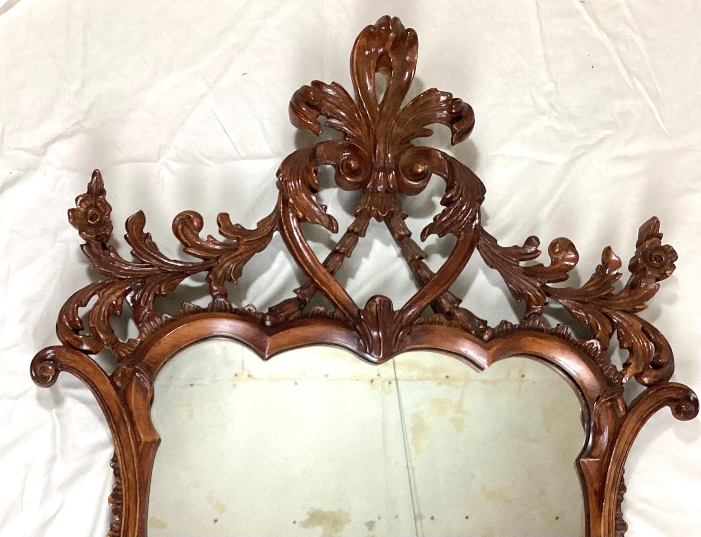 Georgian Rococo wall mirror with a faux wood finish over gesso. 49