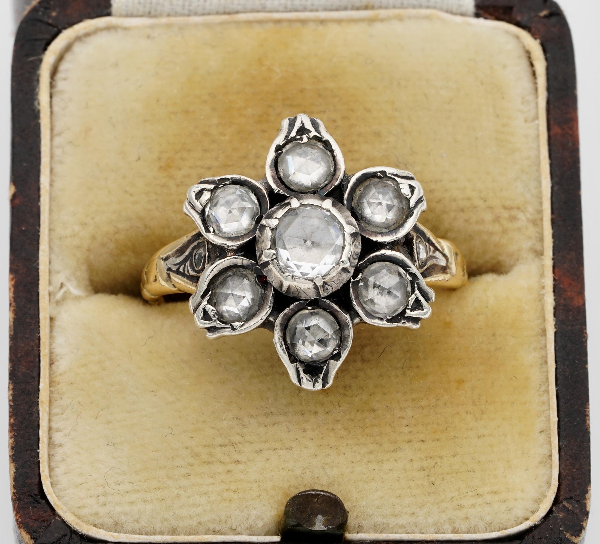 This gorgeous Victorian period Georgian style Diamond ring is 1900 ca
Hand crafted of solid 18 Kt gold with silver portions
Modelled as a sweet flower beautifully detailed and adorned with sparkly rose cut Diamonds
Approx. 1.10 Ct of Diamonds in