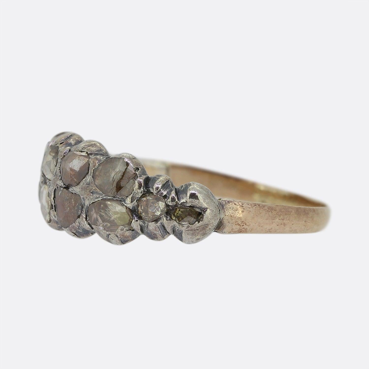This is a wonderful antique Georgian diamond ring. The ring features 12 rose cut diamonds that are set in silver in a typical Georgian style. This ring sits low on the finger so it is quite a practical ring to wear, although it is important to treat