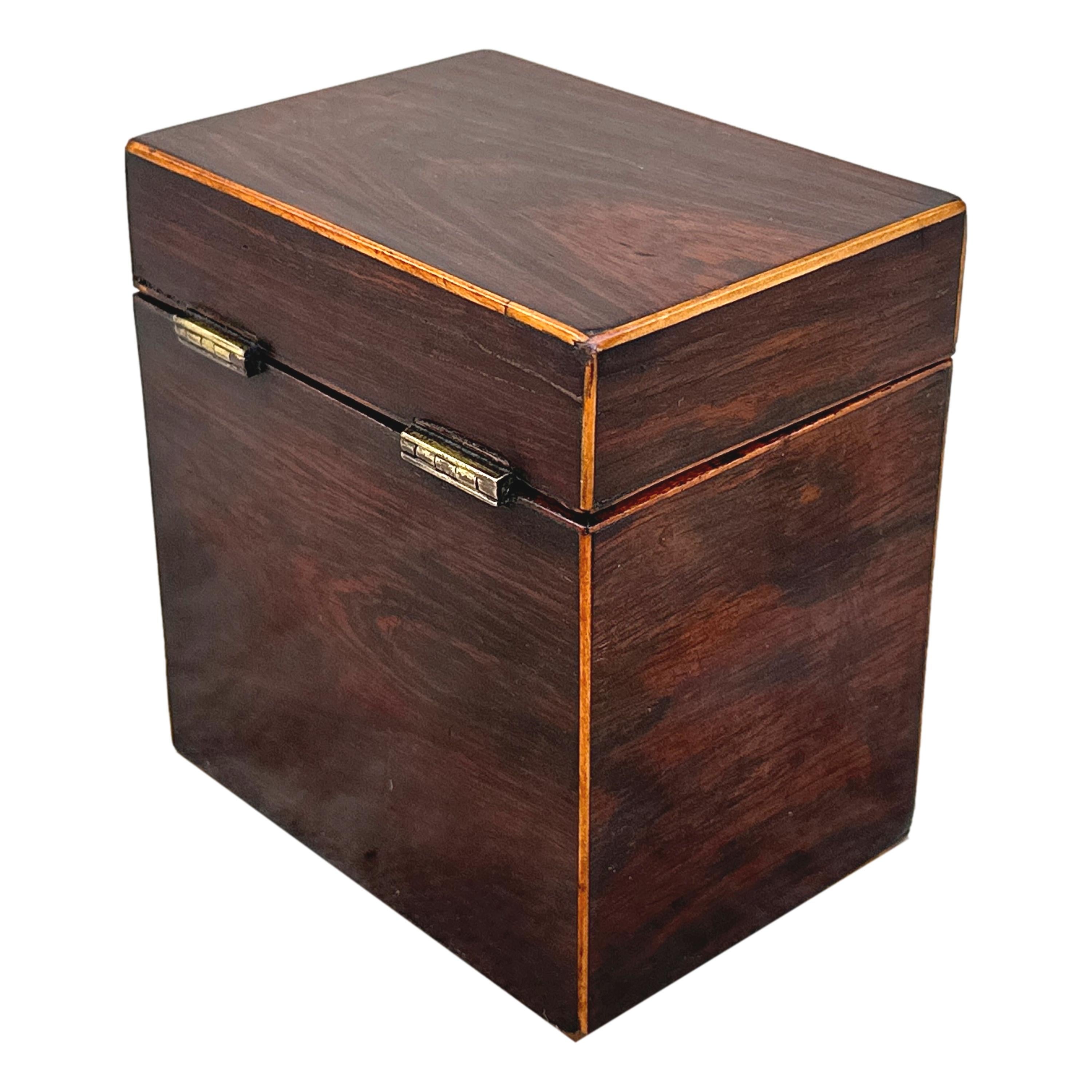 A very attractive, good quality, late 18th century rosewood oblong shaped tea caddy having satinwood strung mouldings and original brass hinges, with working lock and key.

Constructed using attractive rosewood timber which retains a good colour