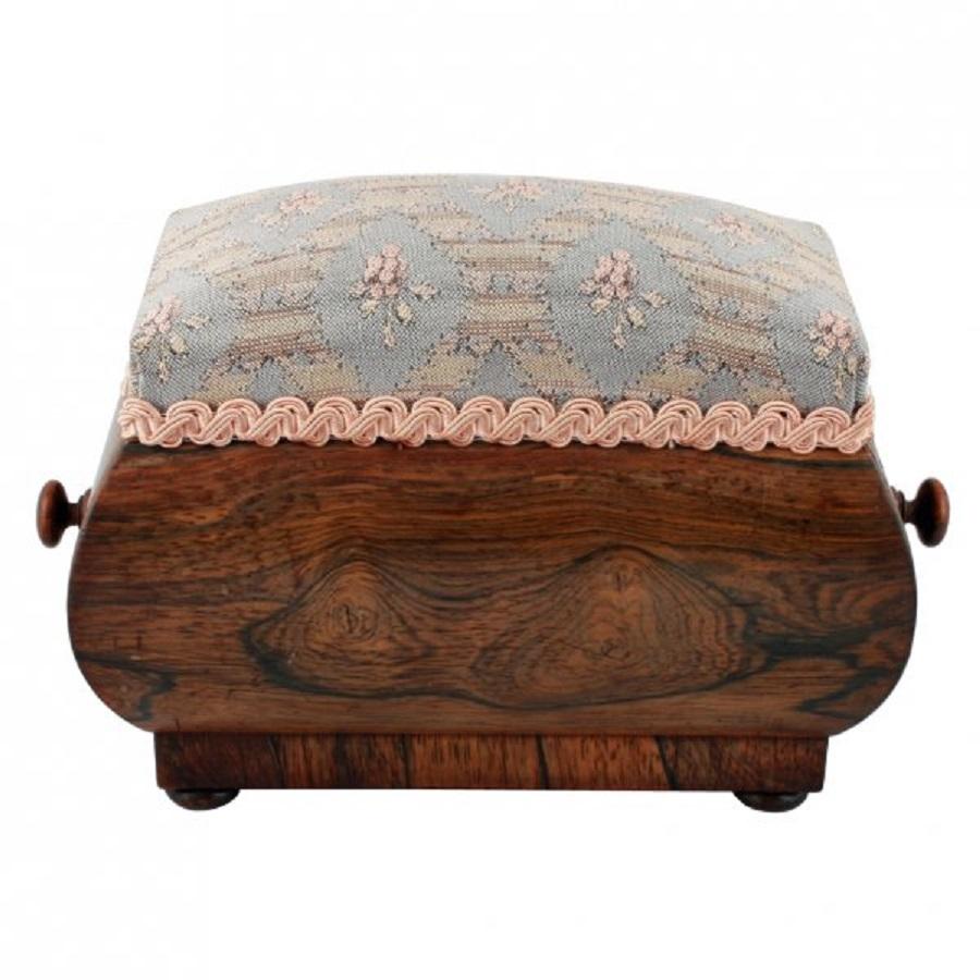An early 19th century George IV shaped rosewood pin cushion box.

The Box has a single drawer and an upholstered top for use as a pin cushion.

The main body of the box is made from a shaped solid block of rosewood with a turned knob at each end